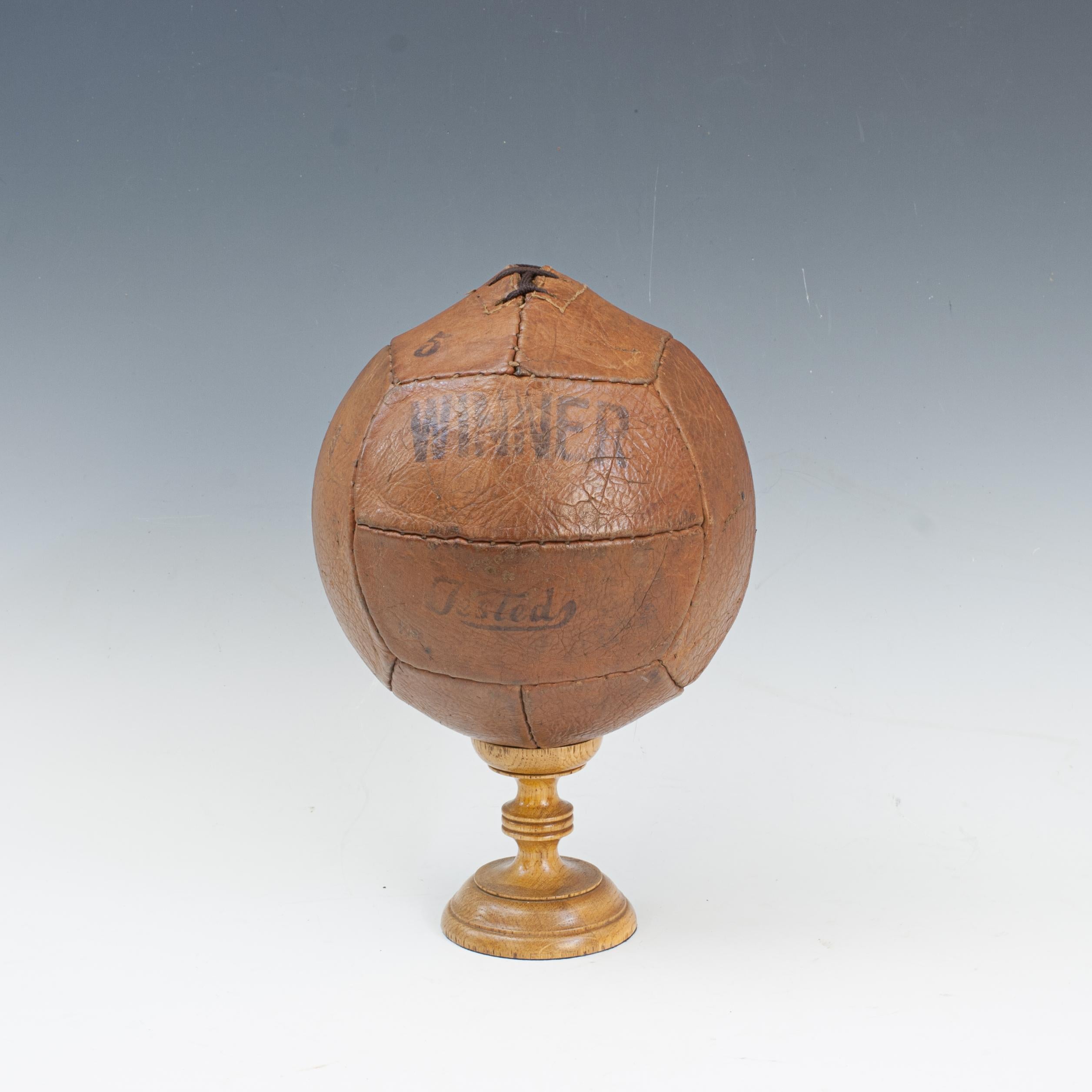 Vintage 12 Panel Leather Soccer Ball.
A great vintage No.5 leather football ball with twelve guaranteed hand sewn leather panels. The ball stencilled 'WINNER' and has a lace-up slit to the top to enable bladder inflation, there is an internal rubber