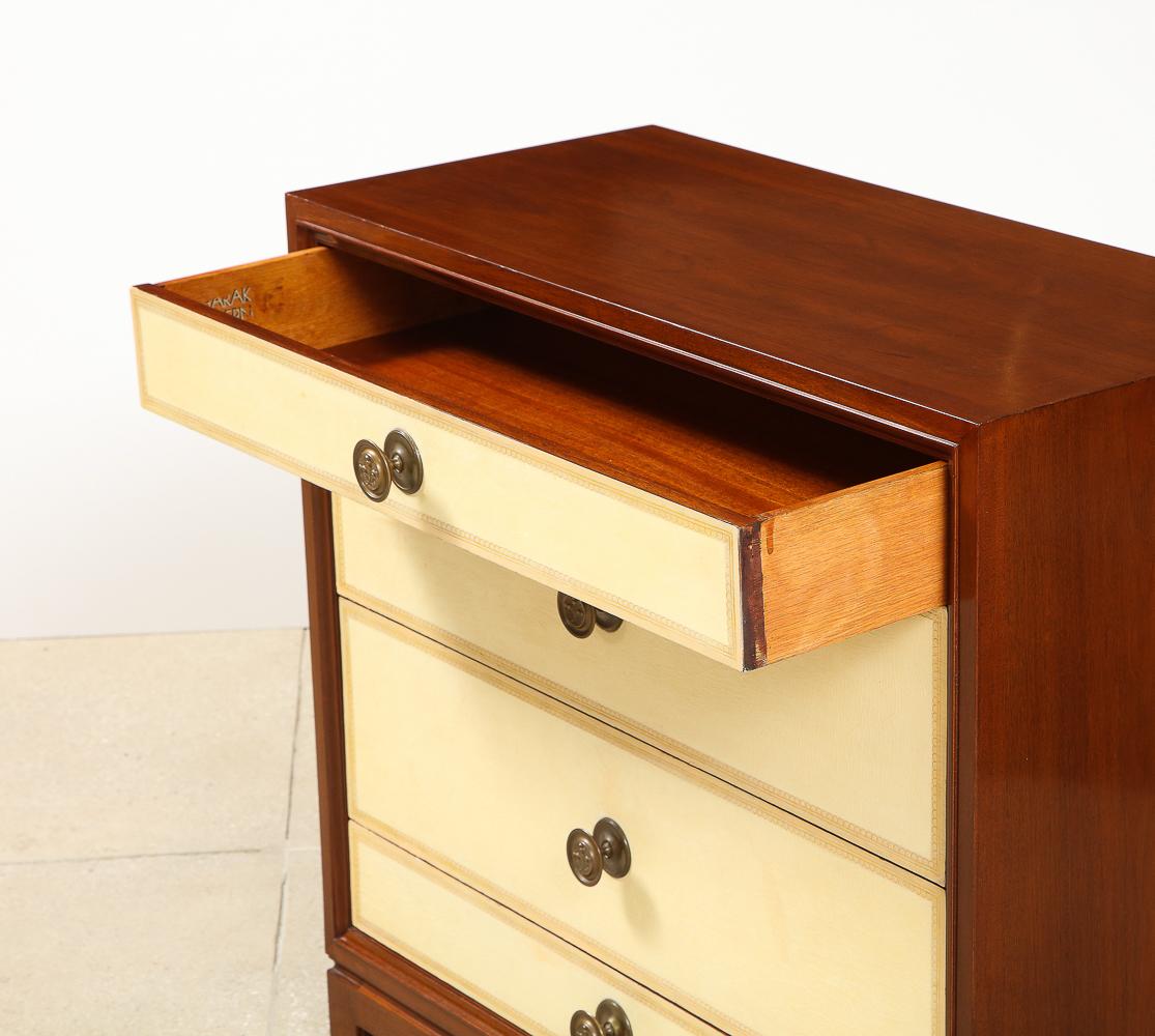 Tooled leather, mahogany and brass. 4-drawer dresser designed for Charak Modern. Makers label attached inside drawer.