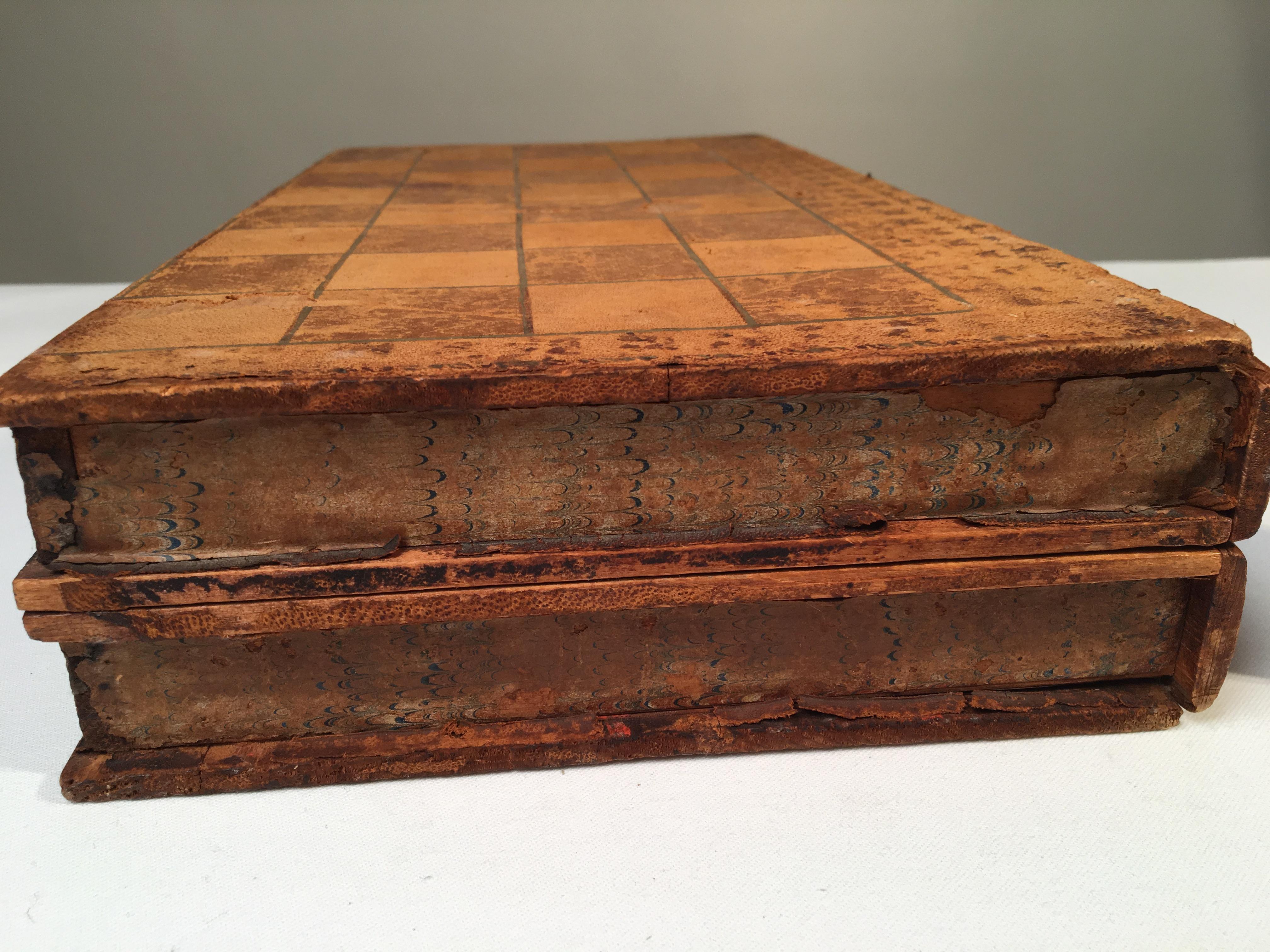 Two game related articles including a leather-covered backgammon/checker board box and a leather playing card box.