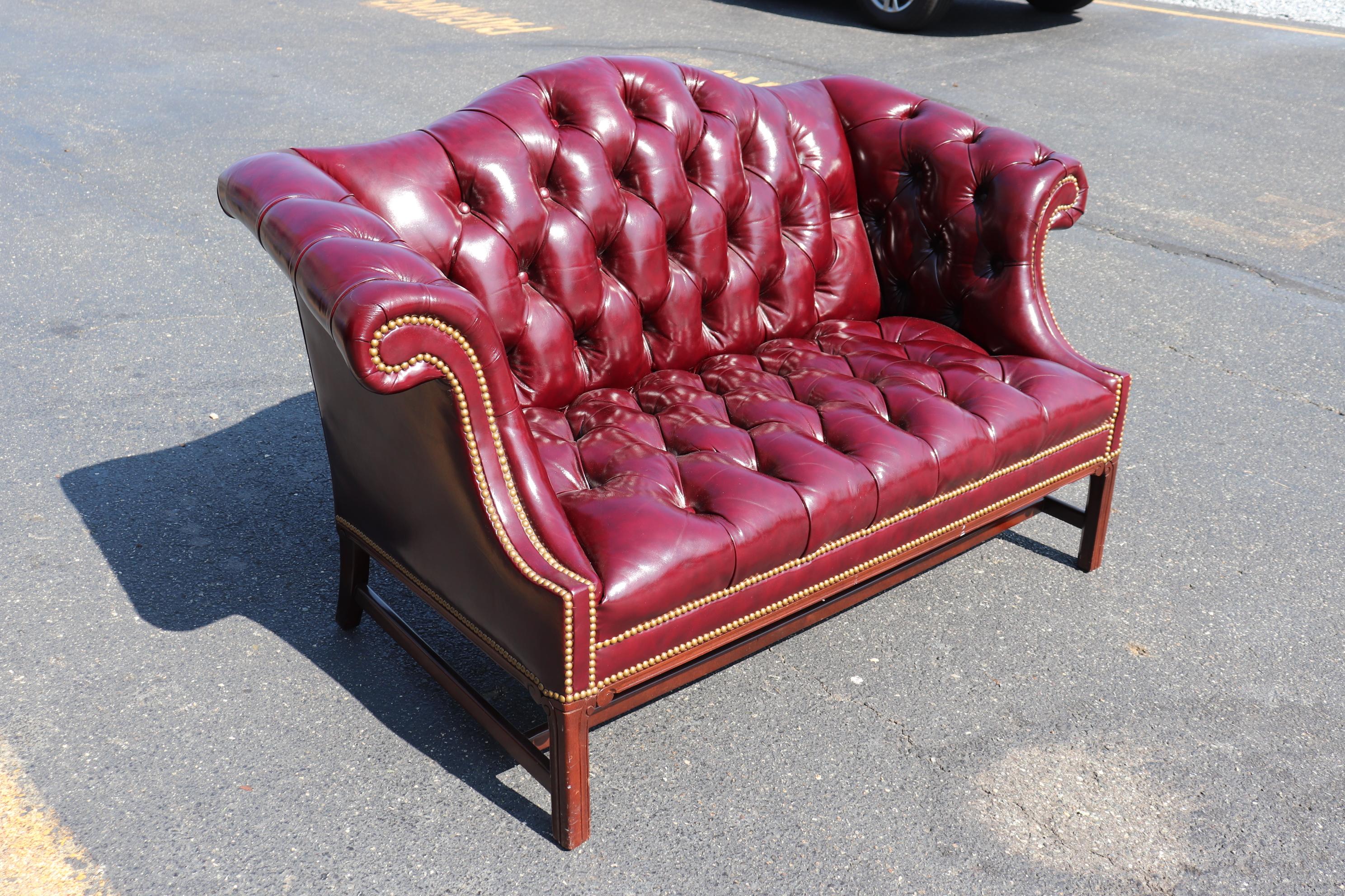 This is a stunning burgundy leather Hancock & Moore loveseat or settee. The leather is in beautiful original condition and measures 60 inches wide x 33 deep x 36 tall and the seat height is 16.5 inches tall. There are no buttons missing and the