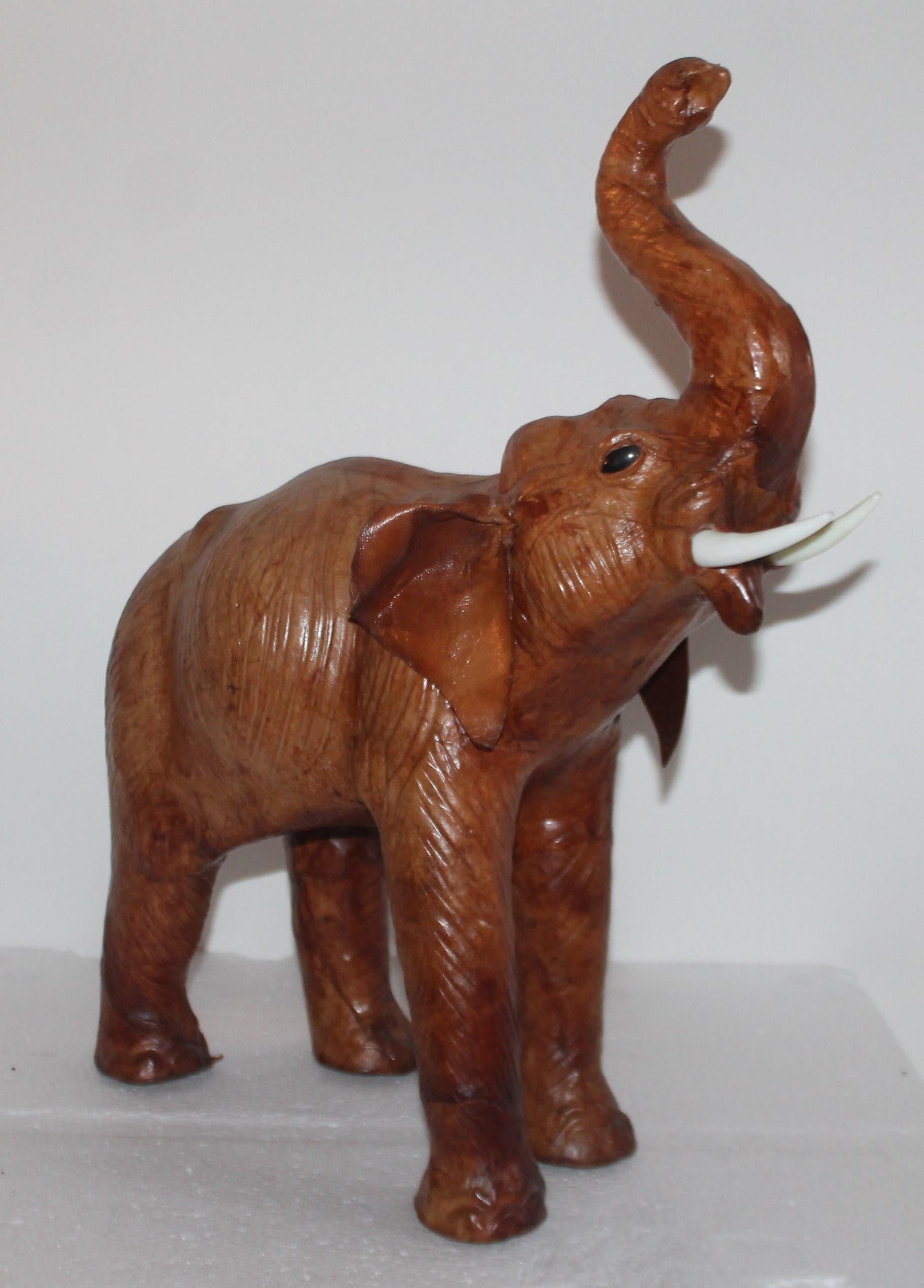 This amazing handcrafted leather elephant is in good condition and is a full size baby elephant. It was probably made in Mexico and is unsigned.