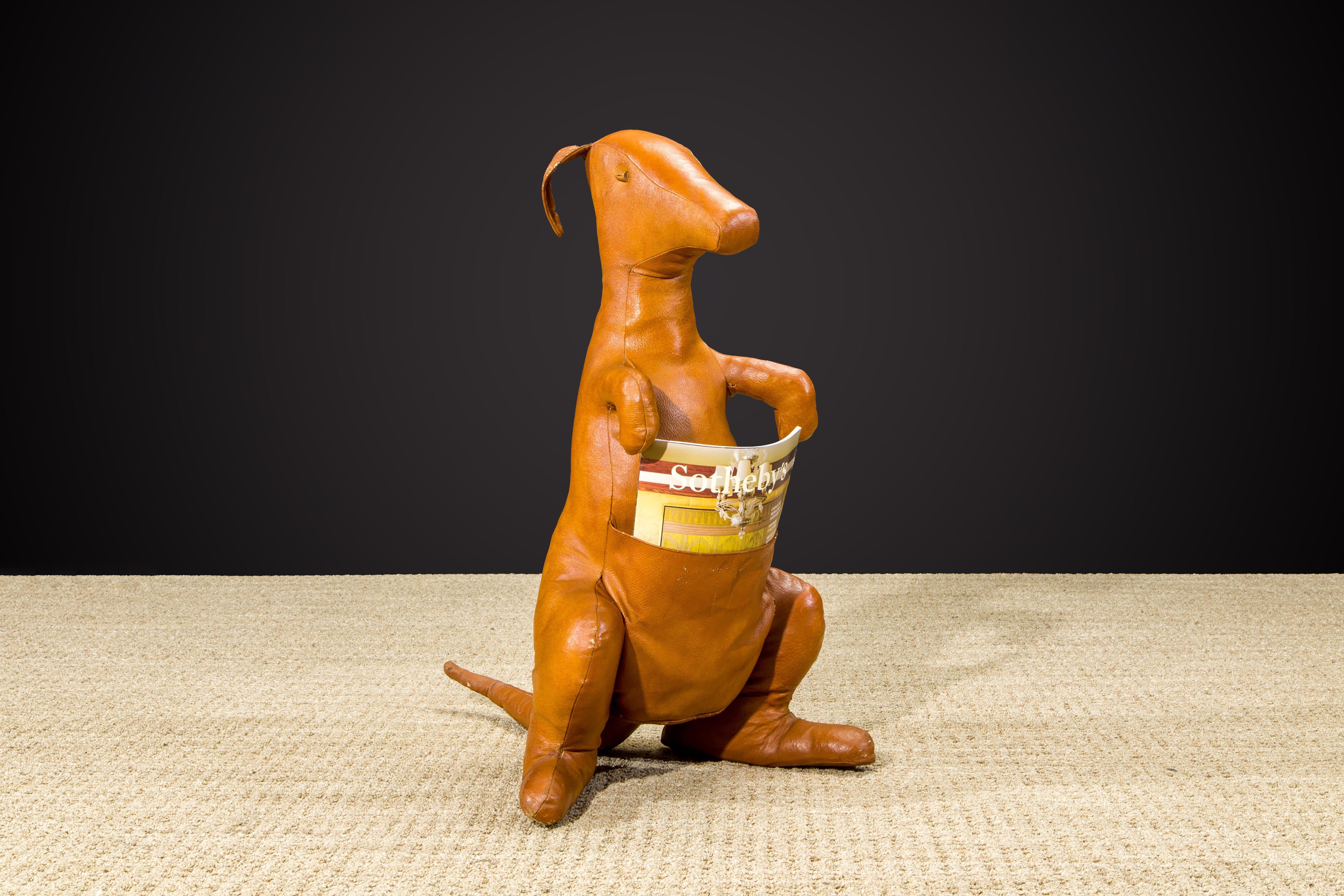 A beautiful large cognac colored leather Kangaroo magazine holder / sculpture by Dimitri Omersa, circa 1970s. Attractive light patina throughout, this charismatic leather animal can serve so many different uses, and makes a fantastic companion while