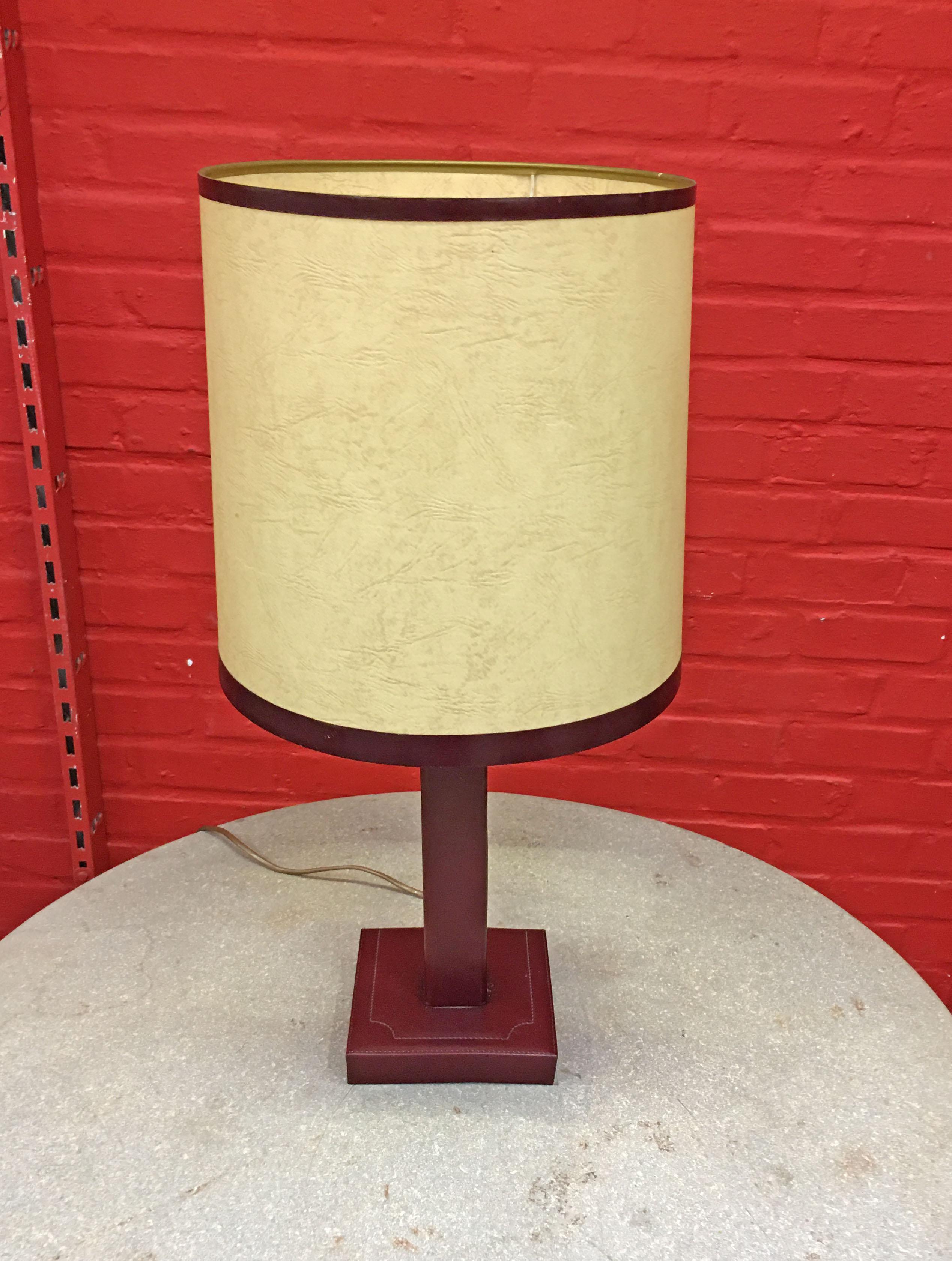 Leather lamp in the style of Jacques Adnet, circa 1950, original lampshade in good condition
signed ' Le Tanneur'.