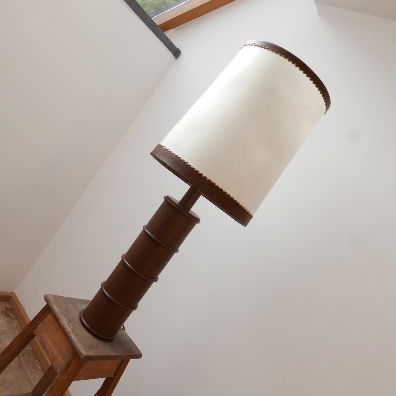 A leather table lamp. 

Belgium, c1970s. 

Originally shade retained but could be a lot more current without it. 

Re-wired and PAT tested. 

Delivery price would be cheaper if shade is not needed. 

Dimensions: With shade 110 height x 40