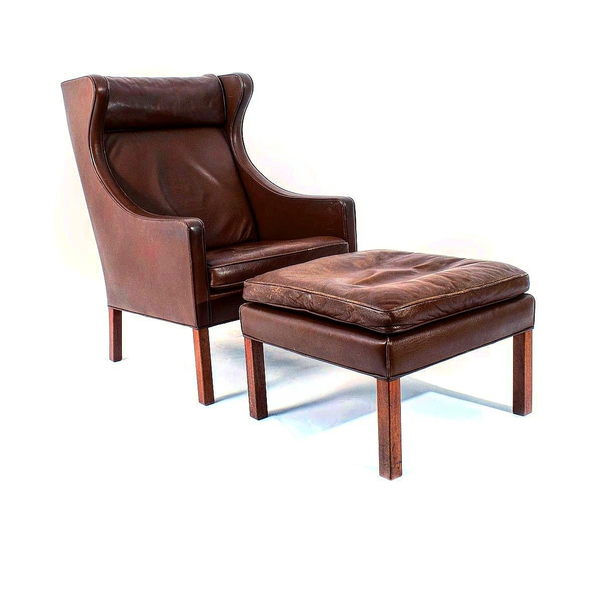 Borge Mogensen brown leather wingback lounge or easy chair; model 2204, and ottoman model 2202. Produced by Fredericia Stolefabrik in Denmark.

He was one of the most important among a generation of furniture designers who made the concept of