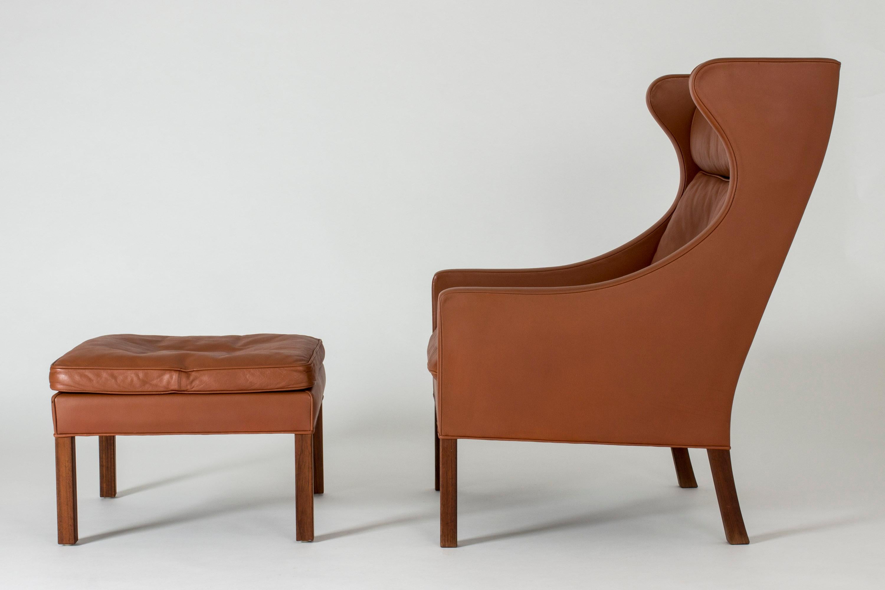 Lounge chair and ottoman by Børge Mogensen with elegant lines. Beautiful rust-colored leather in great condition.