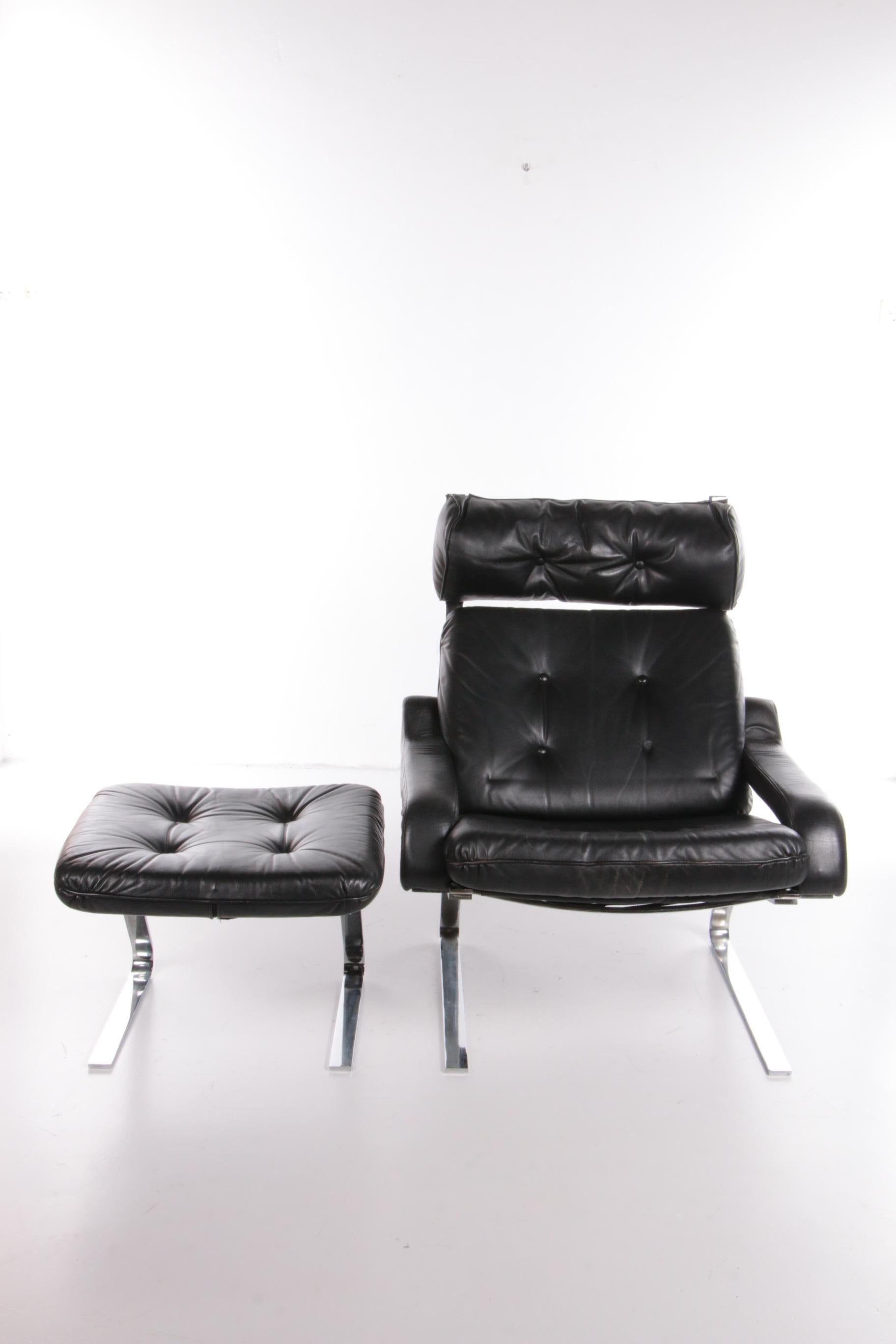 This armchair with ottoman was designed by Reinhold Adolf and produced by COR in the 1960s.

The frame is made of flat steel. The seat and back are made of patinated leather in a beautiful black color. The frame works like a spring, making the