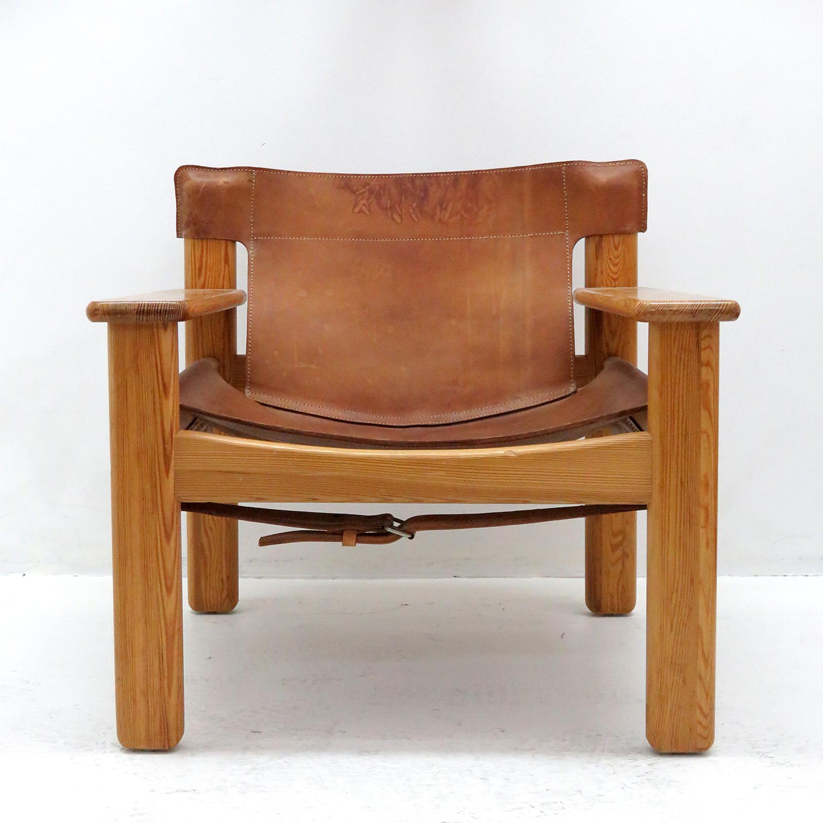 Bold and comfortable Danish modern lounge chair by Karin Mobring, Sweden, designed in 1977, oversized pine frame with thick cognac colored leather with incredible patina.