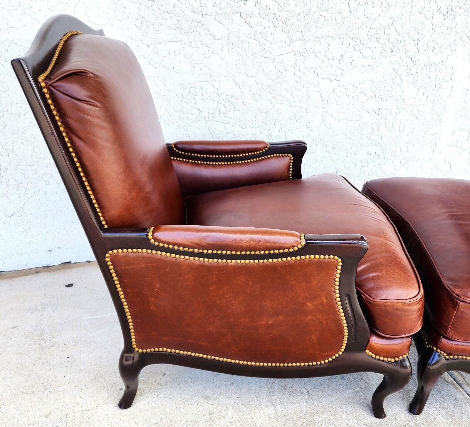 For FULL item description click on CONTINUE READING at the bottom of this page.

Offering One Of Our Recent Palm Beach Estate Fine Furniture Acquisitions Of A
Highly Stylized Top Grain Leather Lounge Chair and Ottoman by Henredon Leather