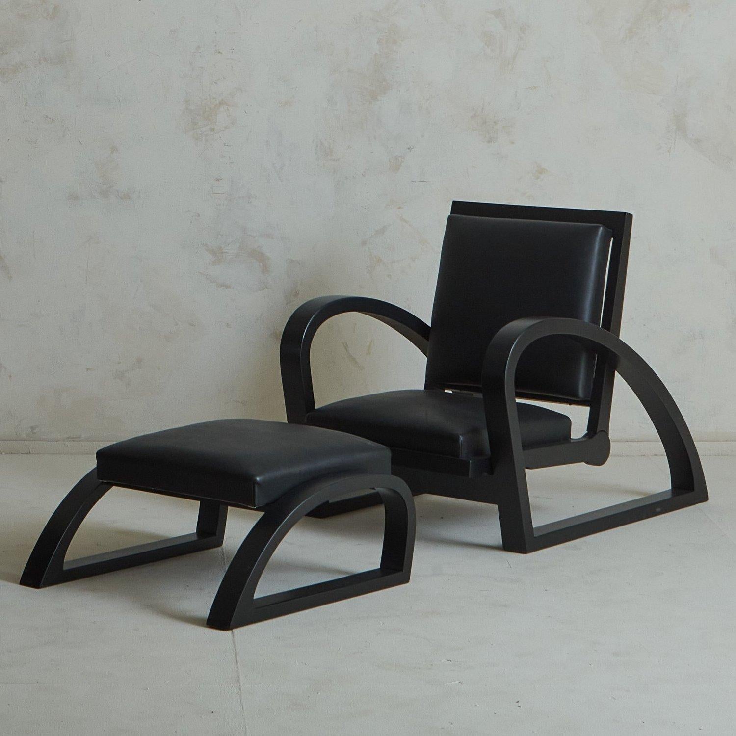 A 1940s French lounge chair attributed to Francis Jourdain. This sculptural lounge chair features a black wood frame with dramatic curves, which reclines to various positions. It has an upholstered seat and back in original black leather. A matching