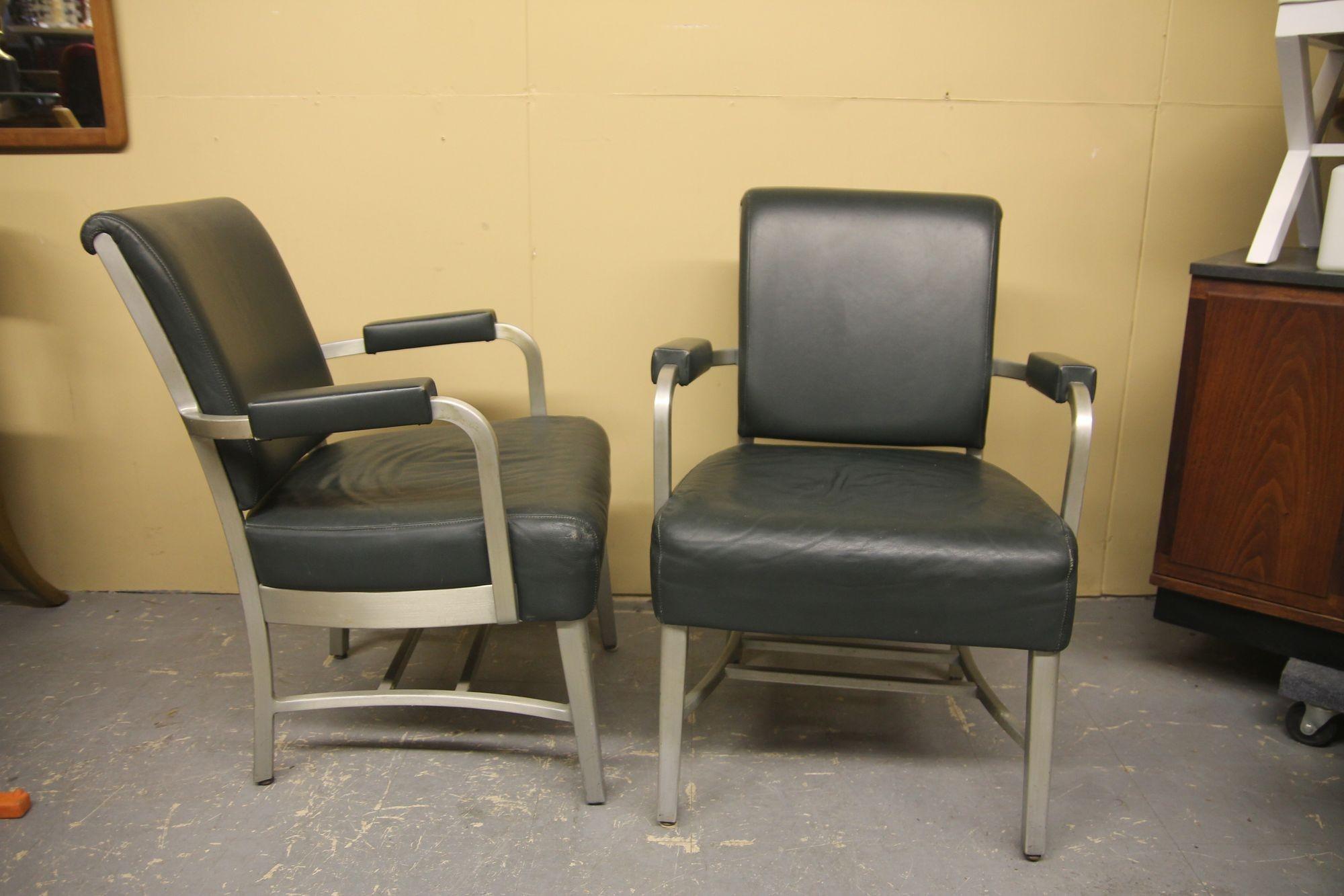 Offered is a wonderful pair of leather and aluminum lounger chairs by Goodform. These oversized chairs were made in the 1940s and still retain the original olive green leather. These chairs are very comfortable and are in great vintage condition