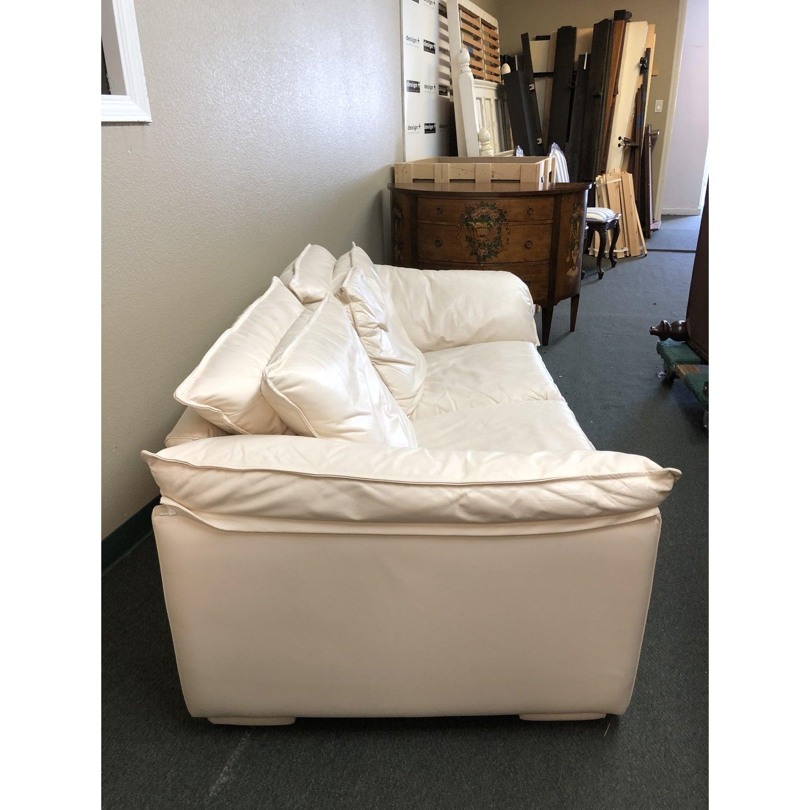 Presents a retro loveseat by Leather Center. The soft, neutral leather is the star here, enveloping the large lounge frame that invites comfort. Attached cushions are foam filled.

Original price $3,000.

 