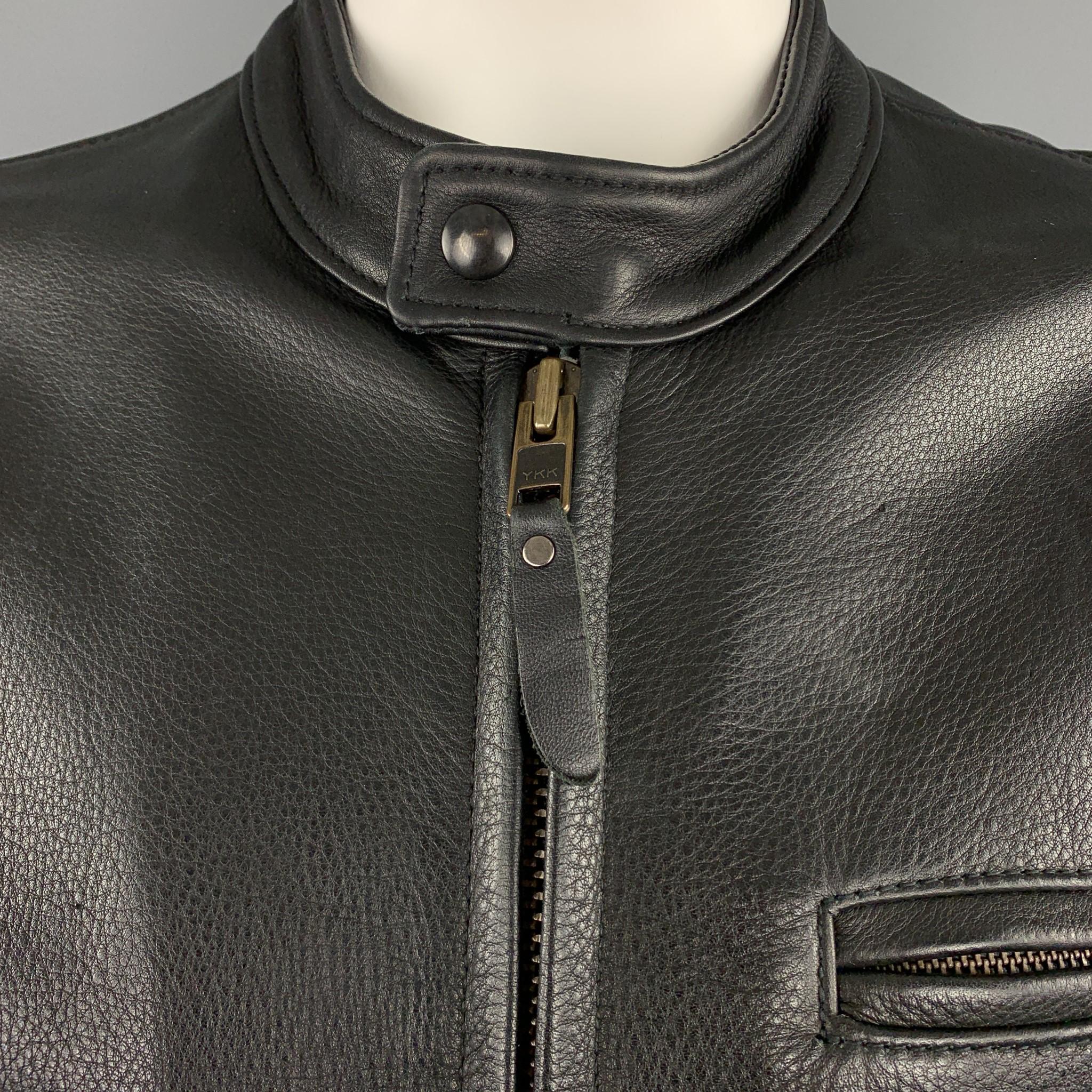 LEATHER MAN motorcycle jacket comes in black textured leather with a tab snap collar, zip pockets, and satin liner. Made in USA.

Very Good Pre-Owned Condition.
Marked: US 46

Measurements:

Shoulder: 20 in.
Chest: 50 in.
Sleeve: 26 in.
Length: 26