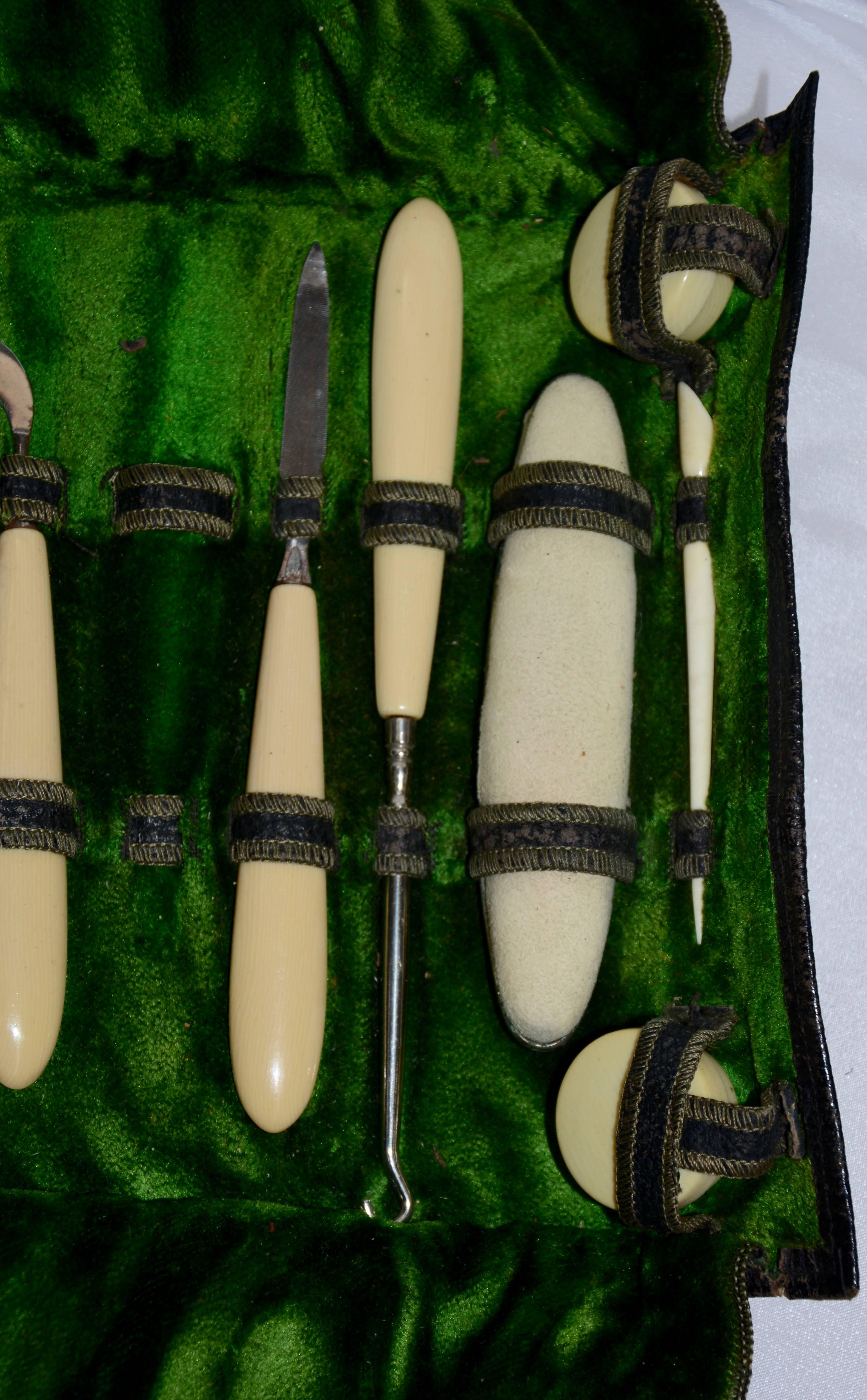 The well worn leather case on this midcentury manicure set tells you it was lovingly used. The tools have vegetable ivory handles with metal ends. The set also includes a buffing pad and two small containers with lids. 

Measurement in listing is