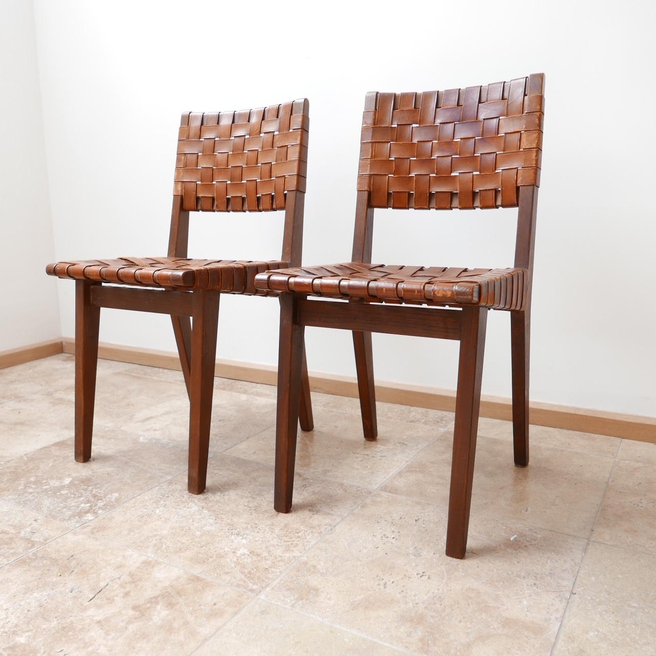 Woven leather side chairs.

Attributed to Jens Risom for Knoll, circa 1940s, likely the model 666.

Midcentury.

Some wear to the leather. One strap has broken and we are looking into repairs at the moment but priced accordingly.

Price for