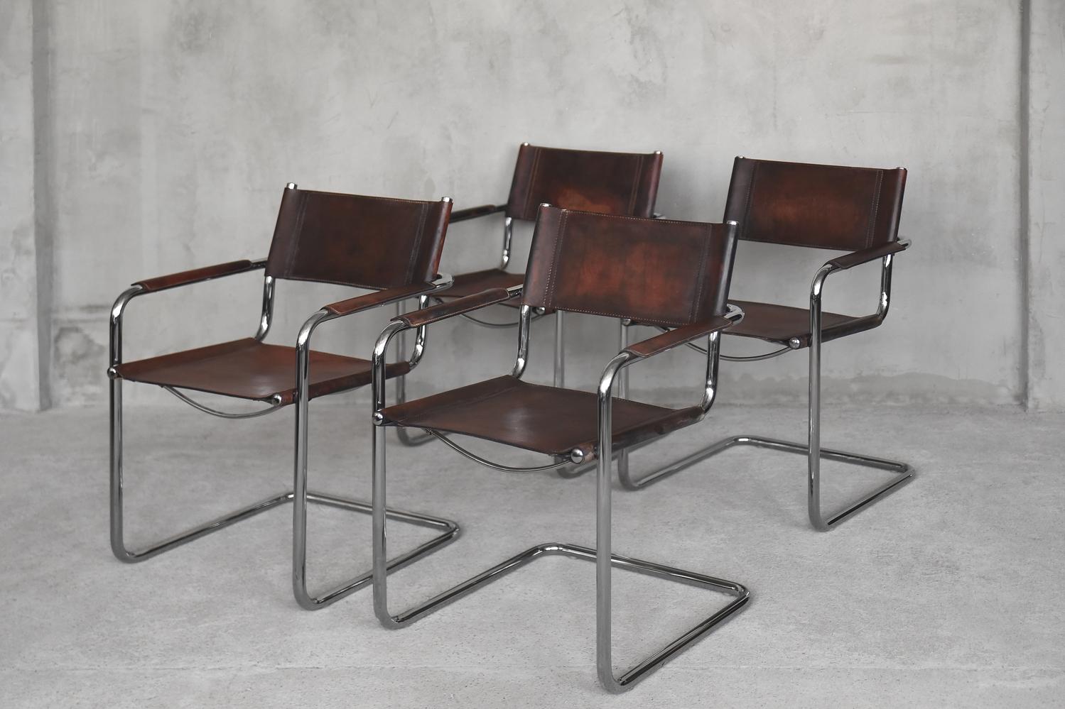 This set of four classic MG5 cantilever chairs was designed by Centro Studi architects for Matteo Grassi. These Bauhaus style chairs were originally manufactured in Italy during the 1960s. The chairs feature beautiful and thick patinated leather