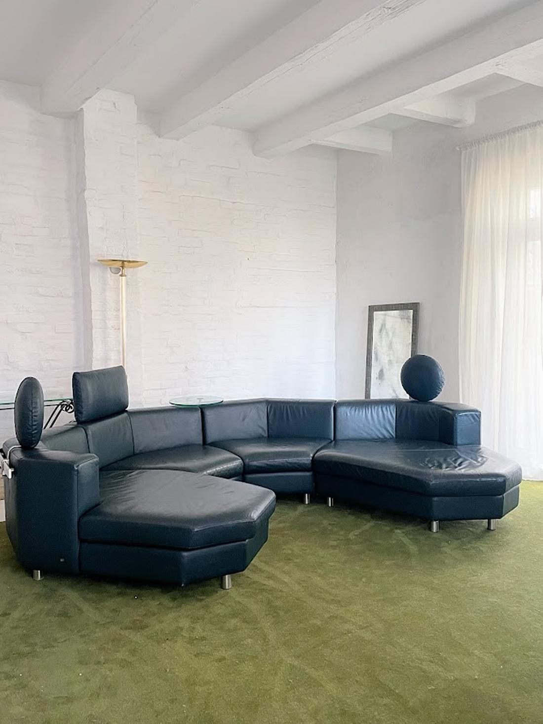 A truly stunning and elegant vintage leather sectional sofa set, crafted by the renowned high-end manufacturer Rolf Benz in Germany during the 1990s. This exceptional piece consists of four separate seating units, offering incredible flexibility and