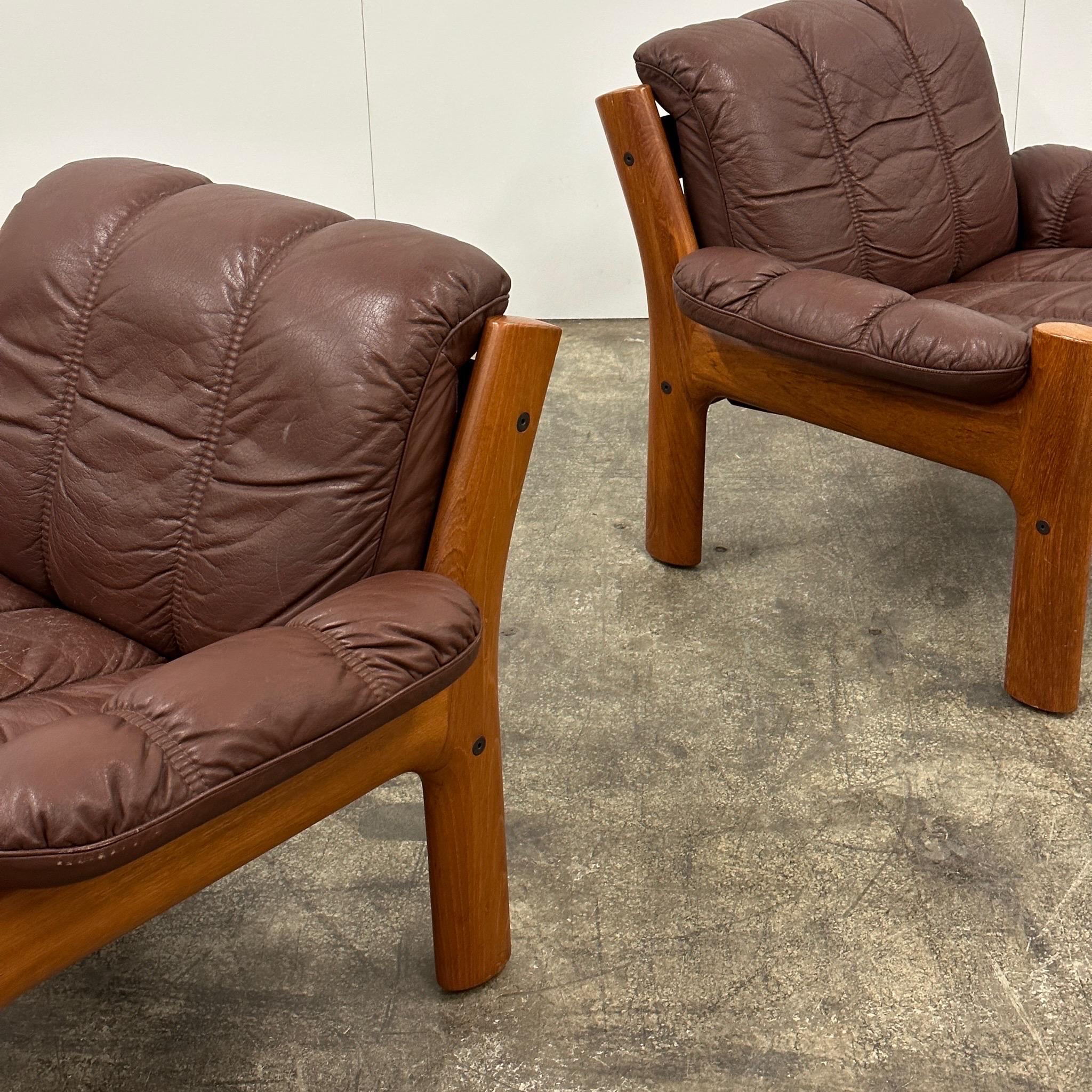 c. 1970s. Price is for the set. Contact us if you’d like to purchase a single item. Danish leather with sculpted heavy wood frame. We have a matching three seater available as well. Made in Norway. 
