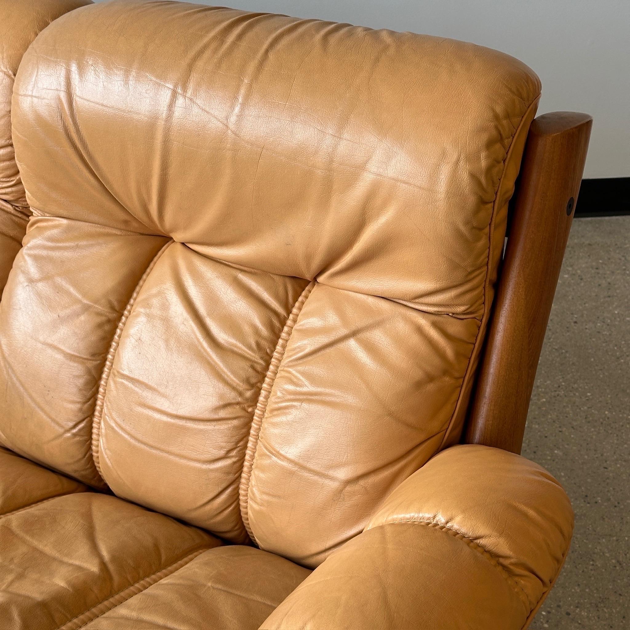 c. 1970s. Danish leather with sculpted heavy wood frame. Made in Norway. 

