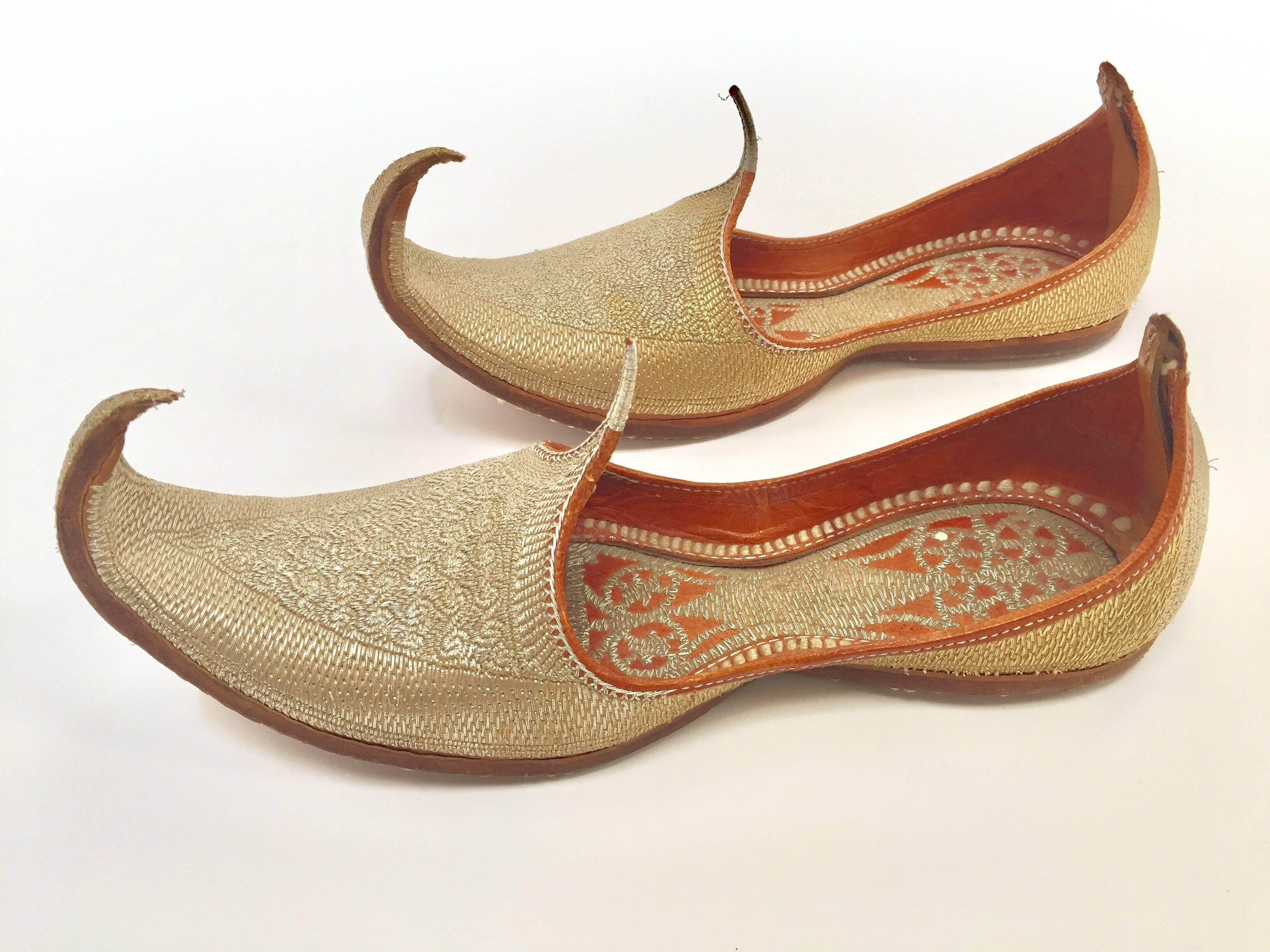 A pair of rare late 19th century hand stitched and hand tooled leather shoes with hand embroidered with gilt metallic threads.
Amazing antique Mughal gold embroidered traditional Islamic Indian leather shoes fit for a Maharaja. 
Arabic Persian
