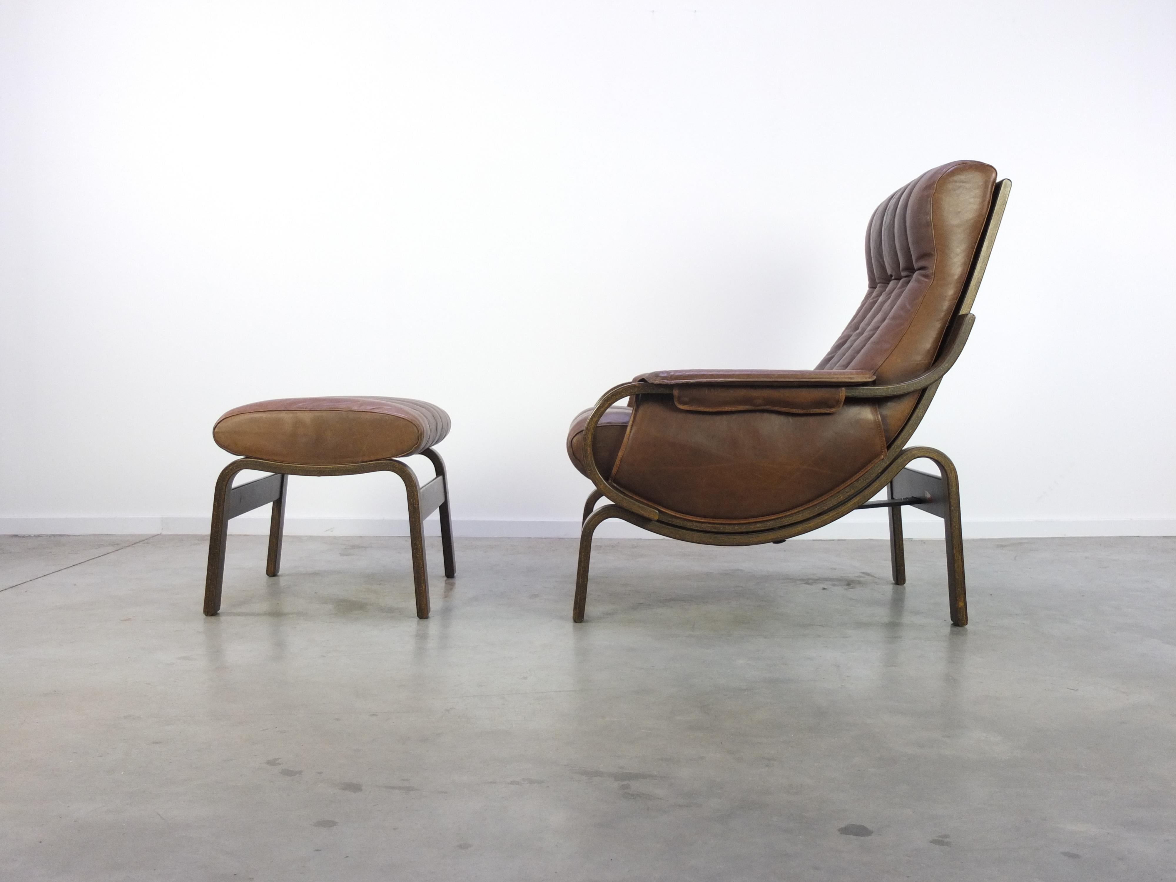 Original ‘Orbit’ lounge chair designed by Ingmar Relling during the 1960s. This example has beautiful soft brown leather with a lovely patina and comes with it rare and original matching ottoman. The chair has two seating positions as seen on the