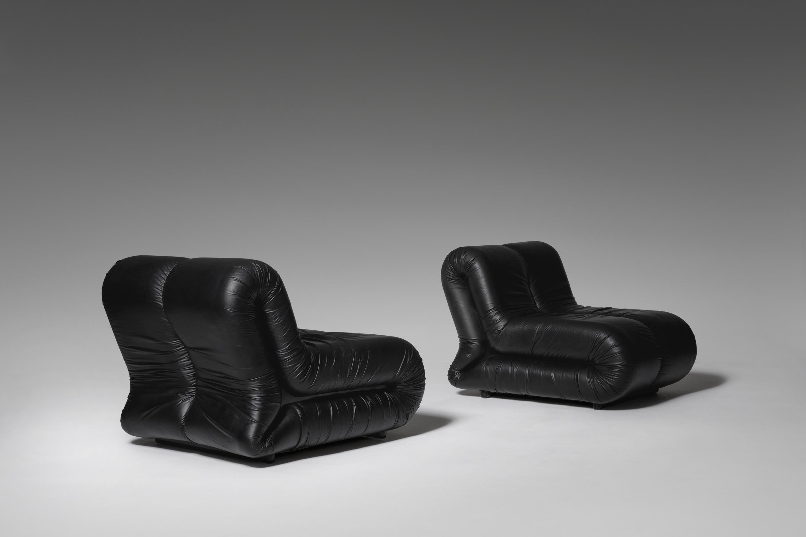 Stunning leather 'Pagrù' lounge chairs by Claudio Vagnoni for 1P, Italy, 1968. Outspoken radical bulky sixties design. The chairs are covered in their original soft black leather. The internal foam is in perfect condition and the chairs provide a