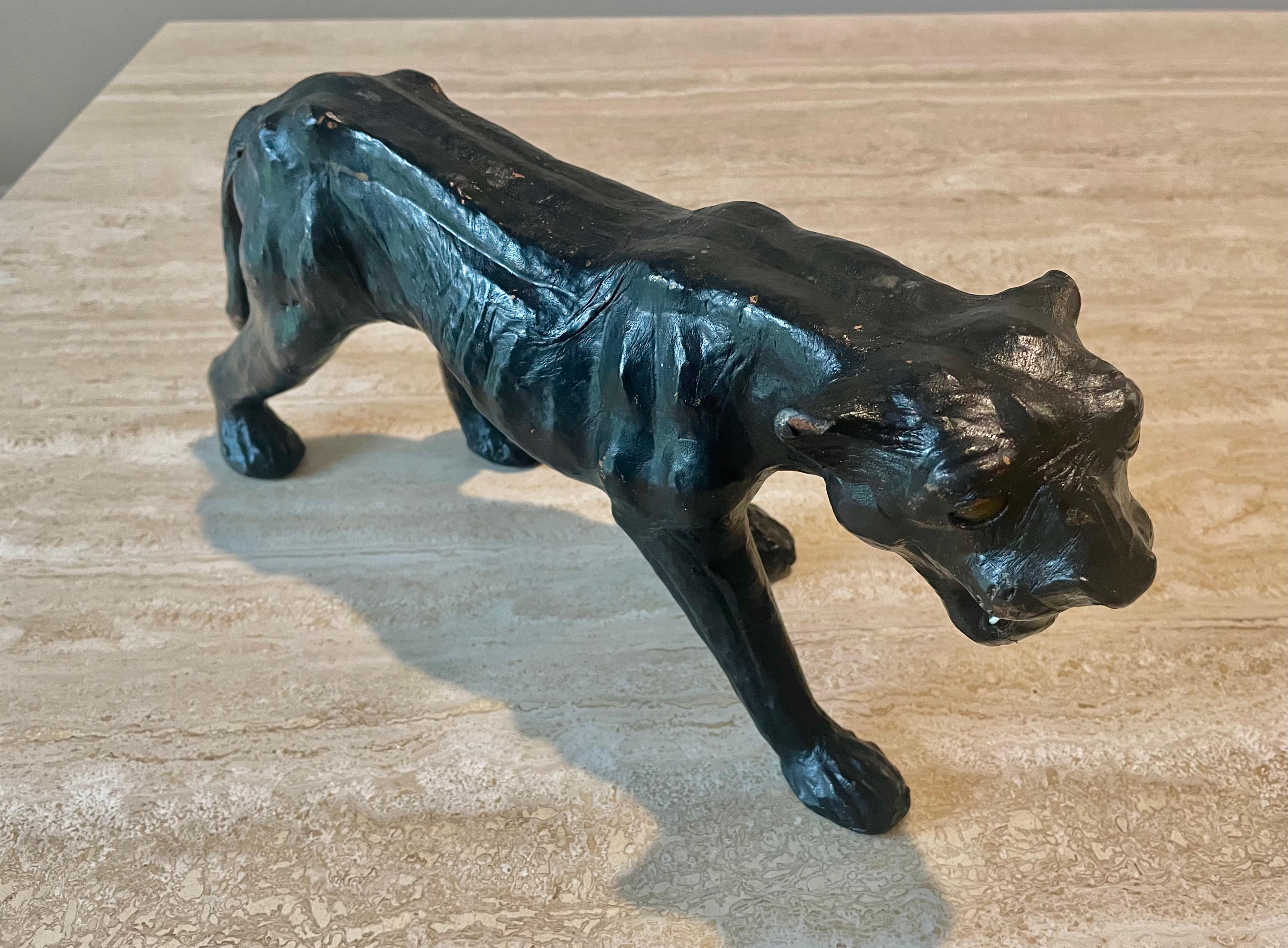 Leather black panther sculpture with a nice patina. Great decorative piece for a shelf or living room.