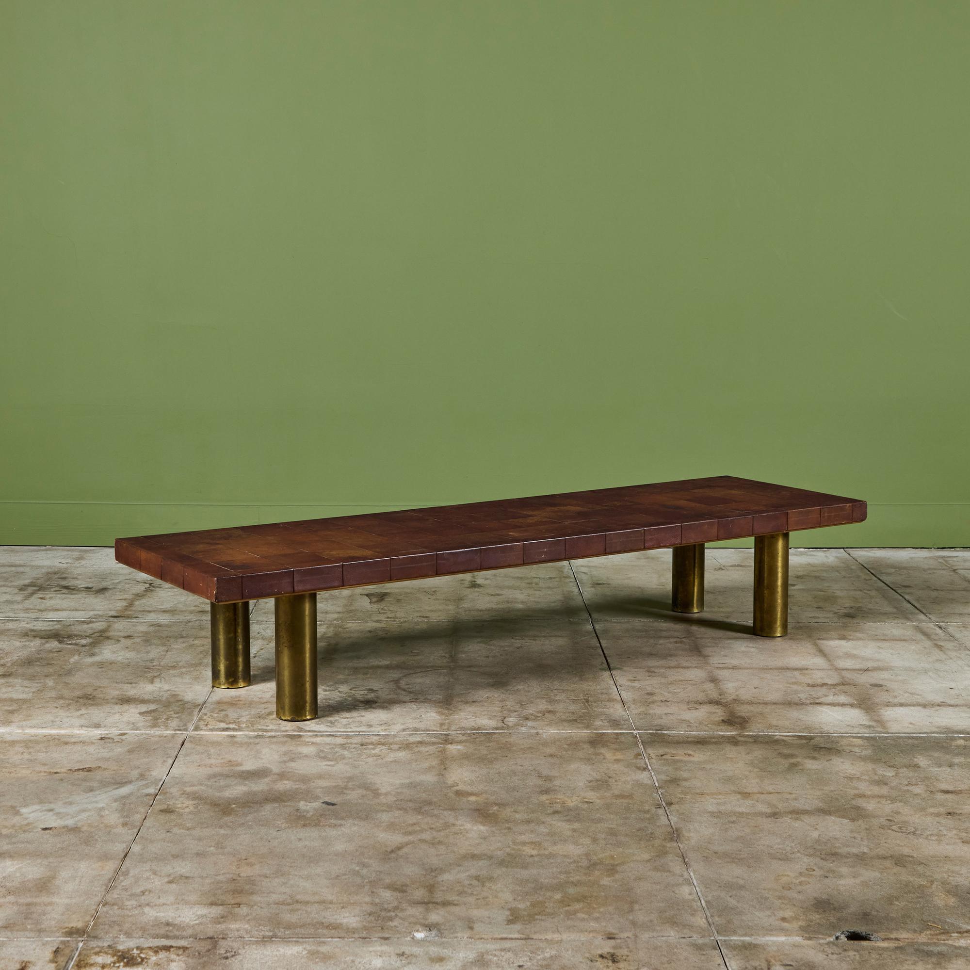 Rectangular leather patchwork coffee table by Bert England produced by Johnson Furniture Co. c.1940s, USA. The table features a leather patchwork table top and tubular brass legs.

Dimensions
72