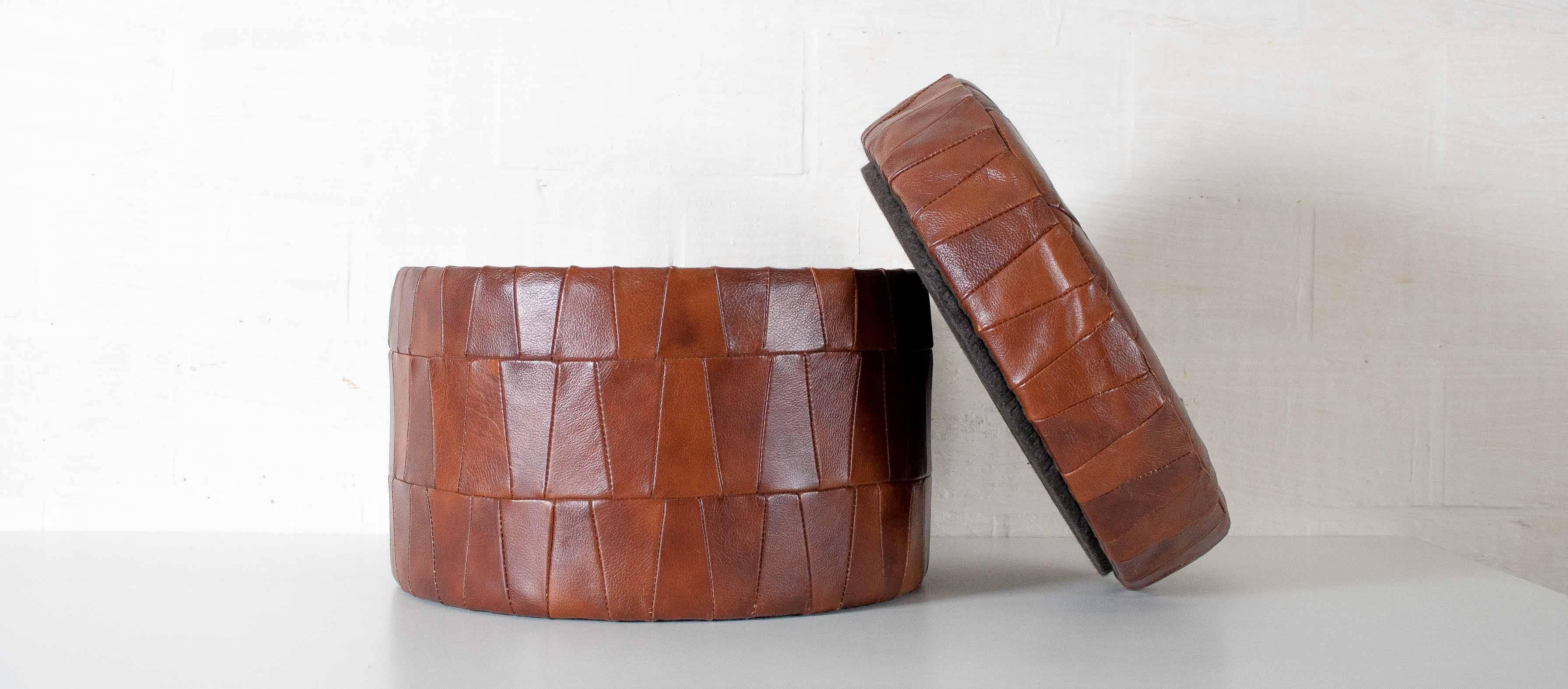 Leather patchwork pouf in brown color.
With trunk.
   