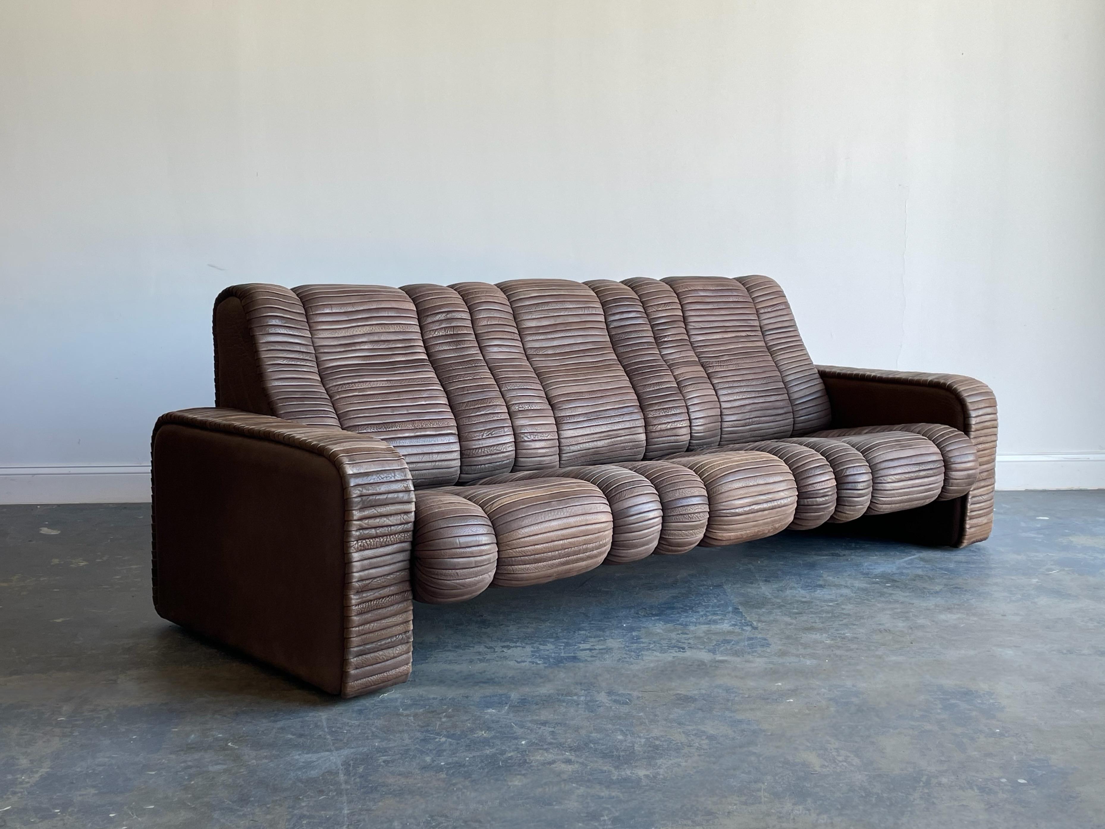 An unusual leather sofa designed by Ernst Lüthy between 1962-1964, who went on to form De Sede in 1965. 

Sofa consists of thick leather strips throughout creating an interesting and organic design. Sofa is incredibly well built, as De Sede has