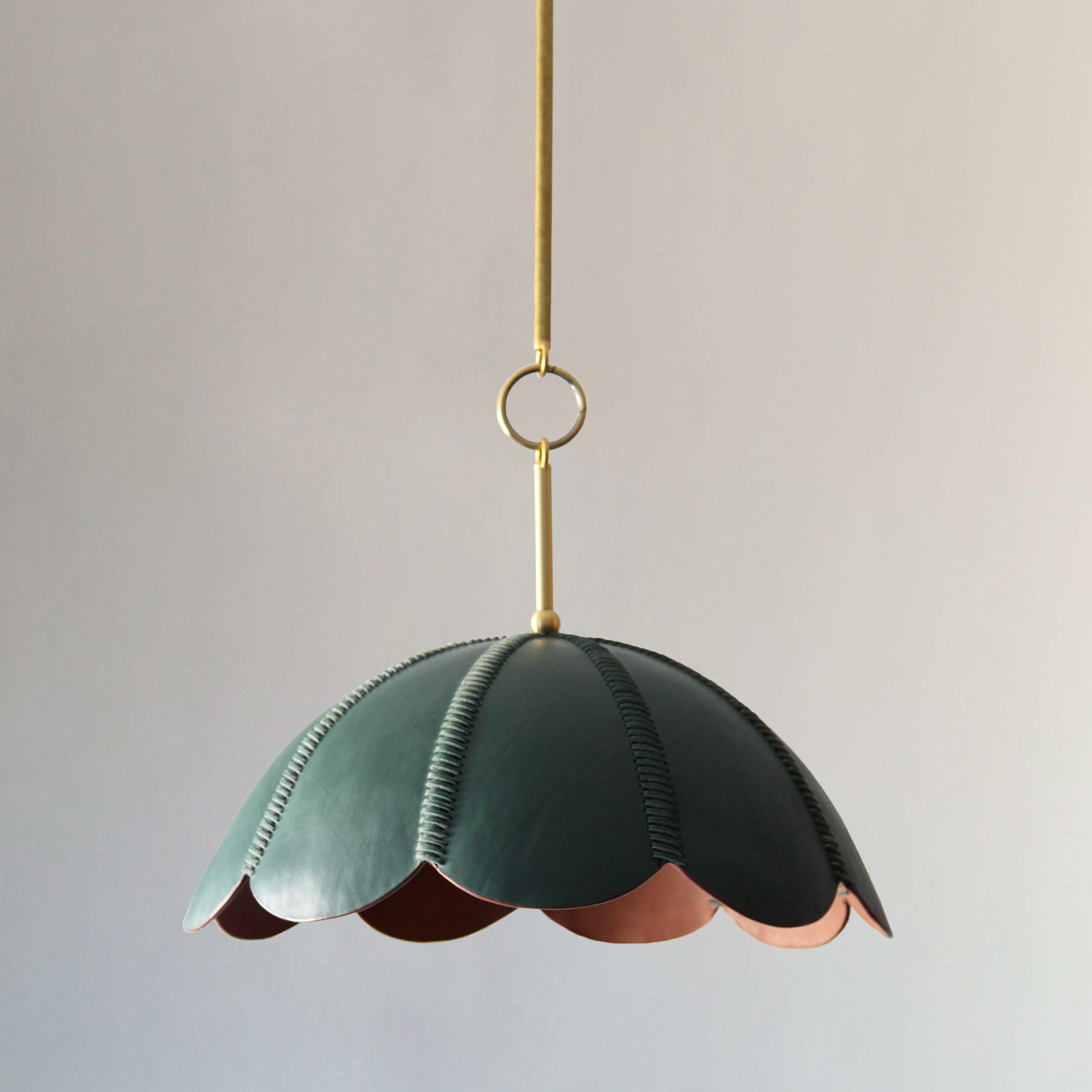 The lamps in this collection are inspired by Colombia’s equestrian heritage, layered with a jewel-toned color palette that takes inspiration from the works of
Colombian artist Fernando Botero.

Talabartero translates as ‘master saddler,’ and the