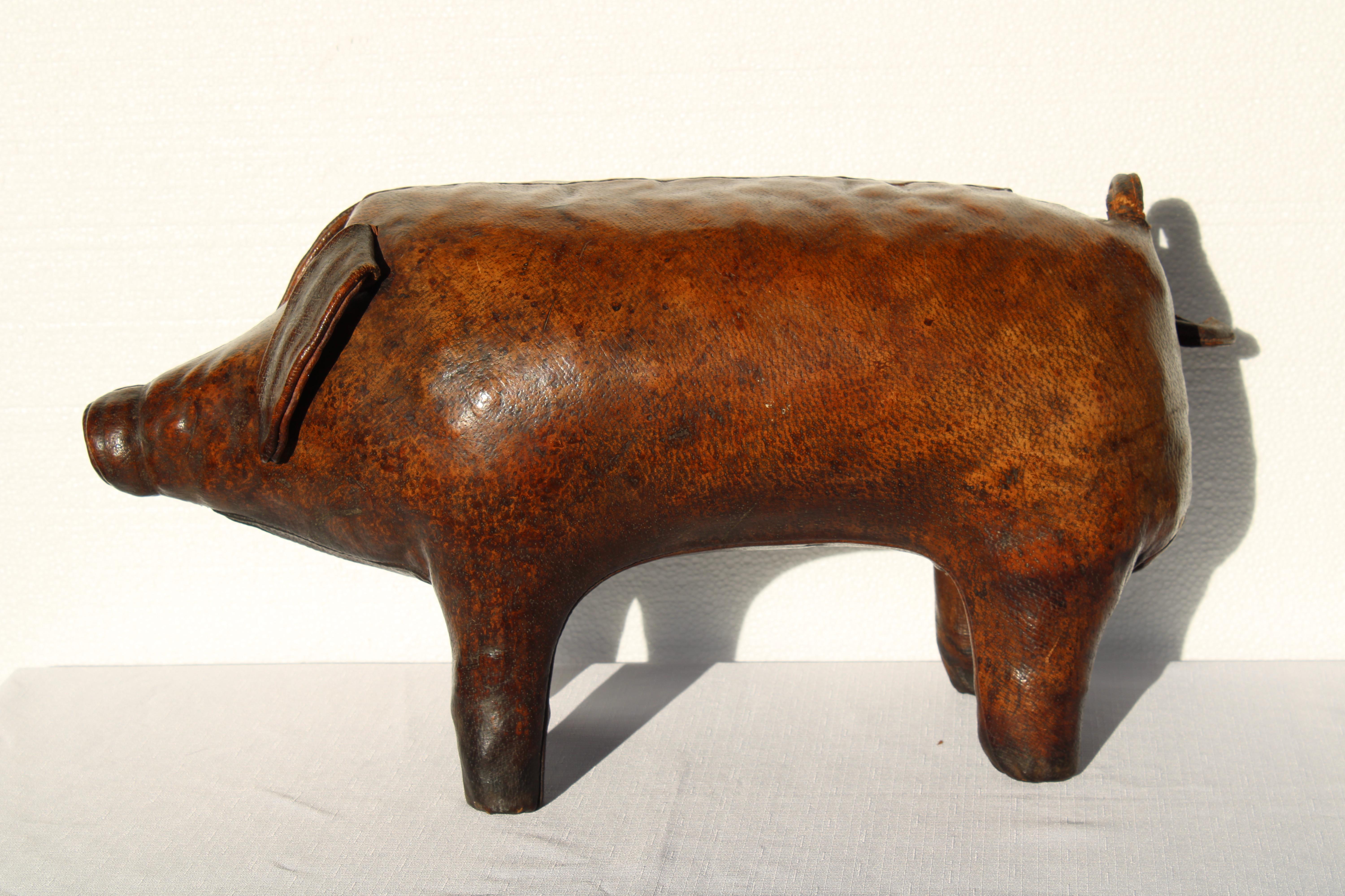 Leather pig ottoman made by Dimitri Omersa, United Kingdom for Abercrombie & Fitch.  Leather tag says Made in England.  Piggy measures 24