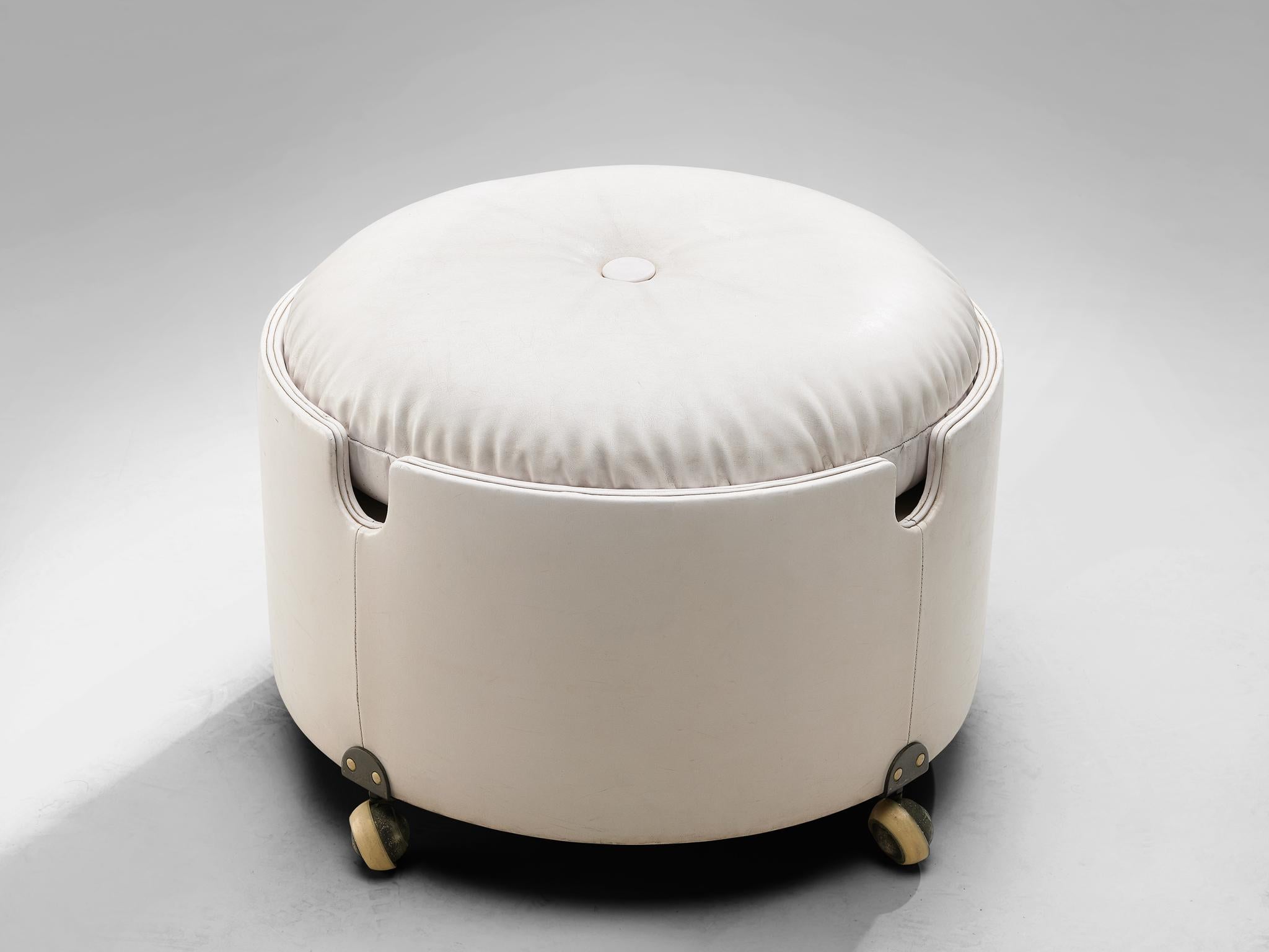 Luigi Massoni for Poltrona Frau, pouf on wheels, leather, plywood, Italy, 1968.

This pouf designed by Luigi Massoni for Poltrona Frau and is part of the Dilly Dally series. The pouf is made out of curved and padded plywood covered with leather and