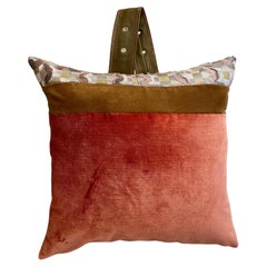 Leather “ purse” pillow with Cinnamon and Tangerine Velvet