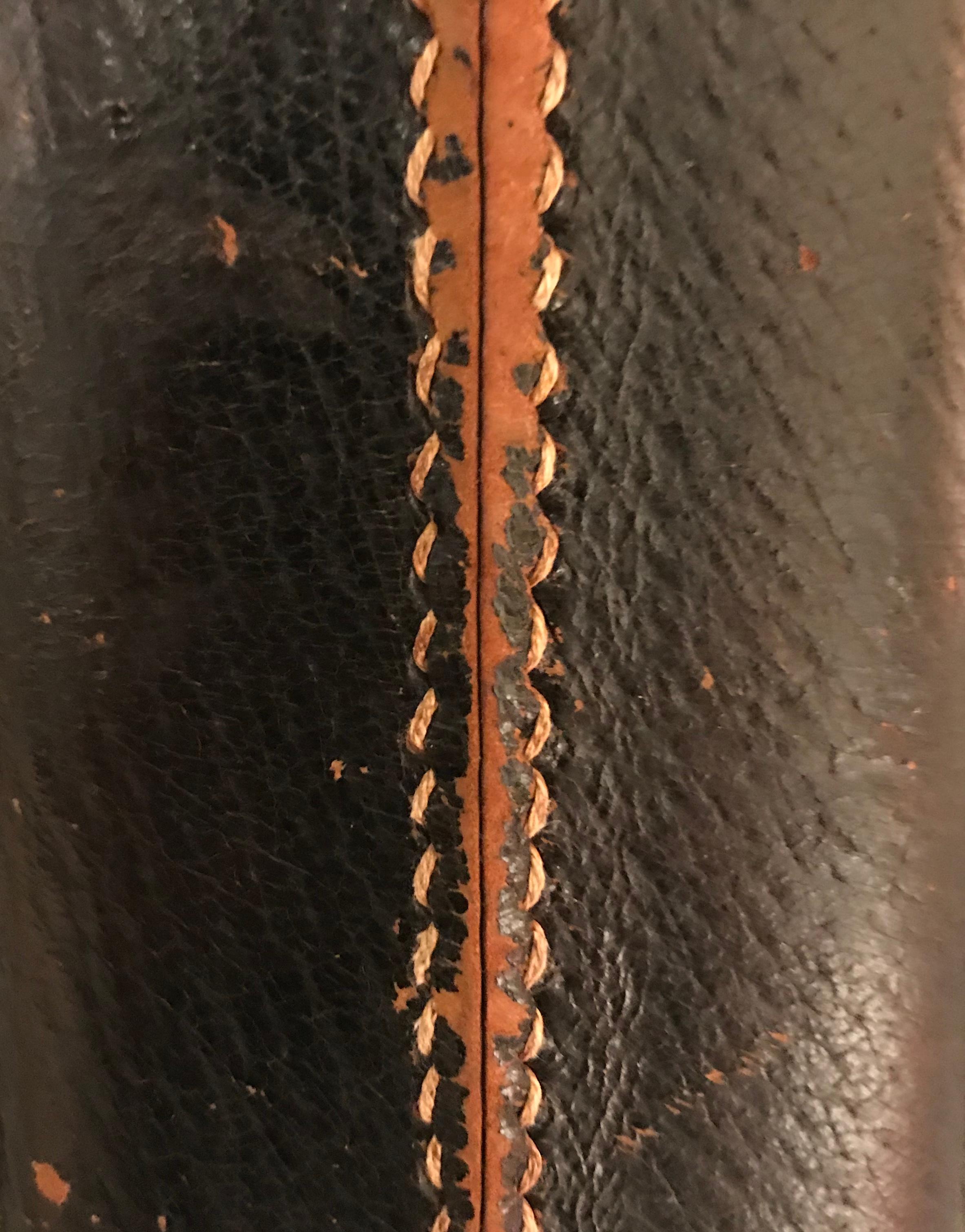 Midcentury Spanish dark brown leather pyramid shape base single lamp.
Top stitching at center front seam.
Black Belgian linen shade.
Shade diameter 20.5