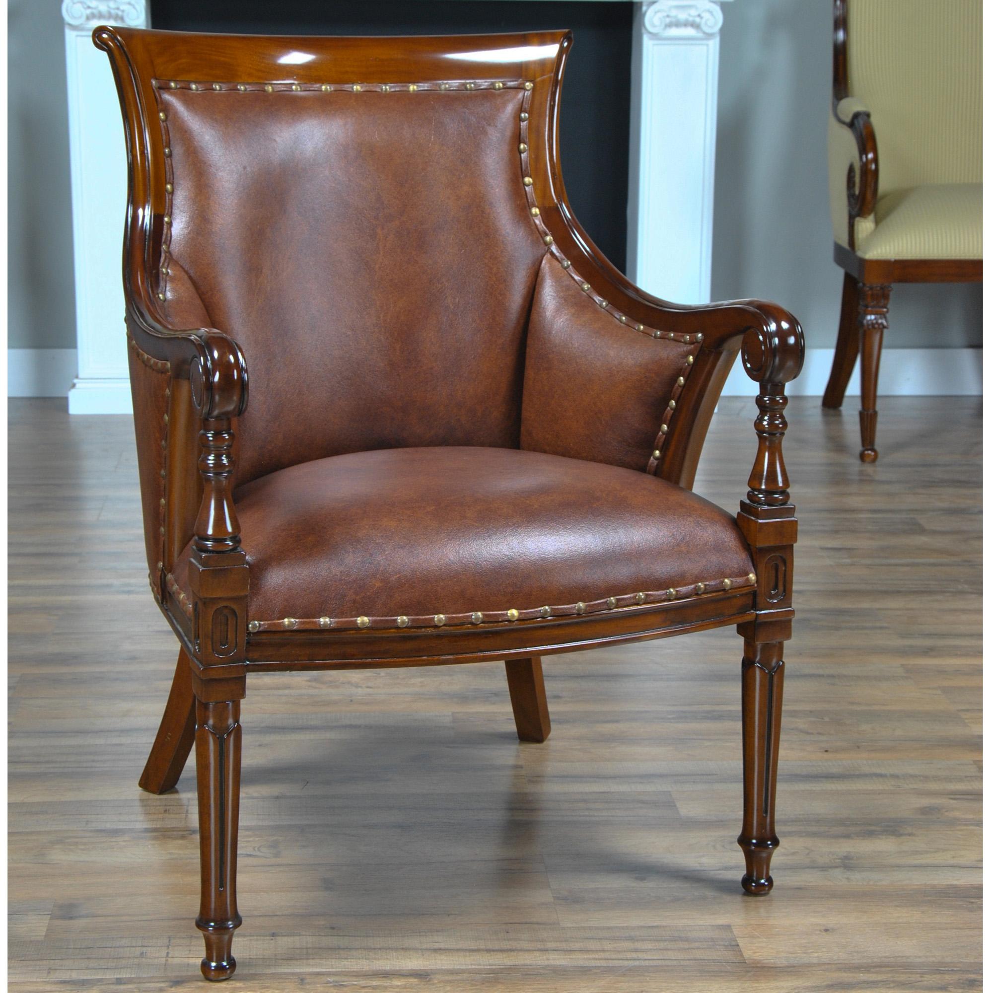 The Niagara Furniture Leather Regency Chair is upholstered using only genuine full gran leather and accented with brass nail trim. This Regency style chair is often used along the Niagara Furniture collection of office desks although the chair is