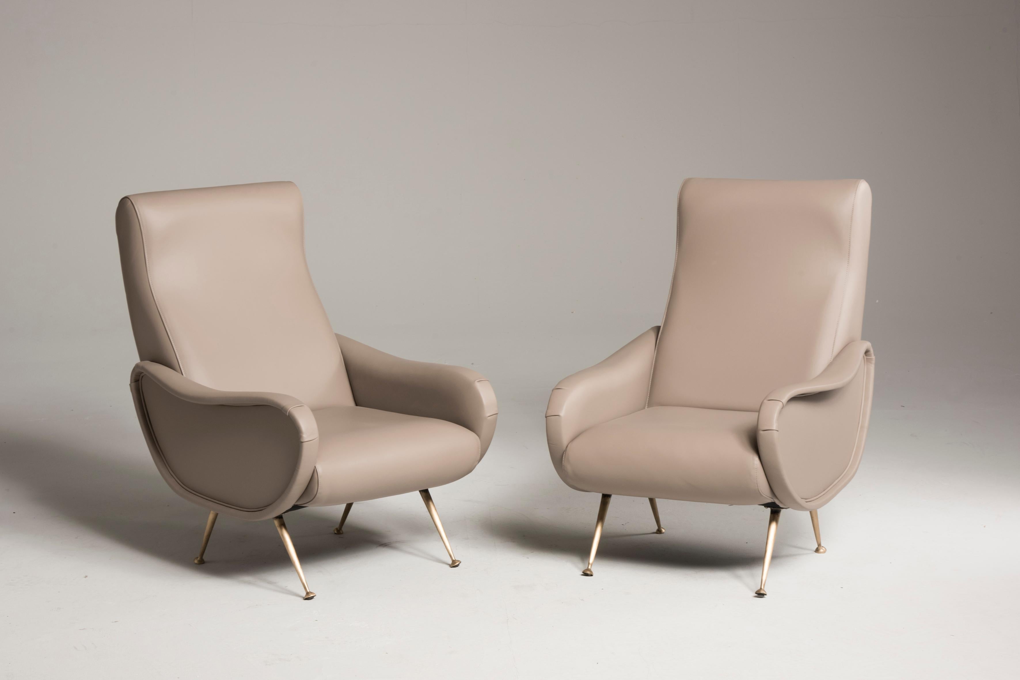 Pair of armchairs in the style of Lady armchairs by Zanuso, from Italy from midcentury period.
Reupholstered in premium quality mauve color leather. New paddings.
Brass legs.
Size: H 94 cm, W 67 cm, D 80 cm
A video is available upon request.
 