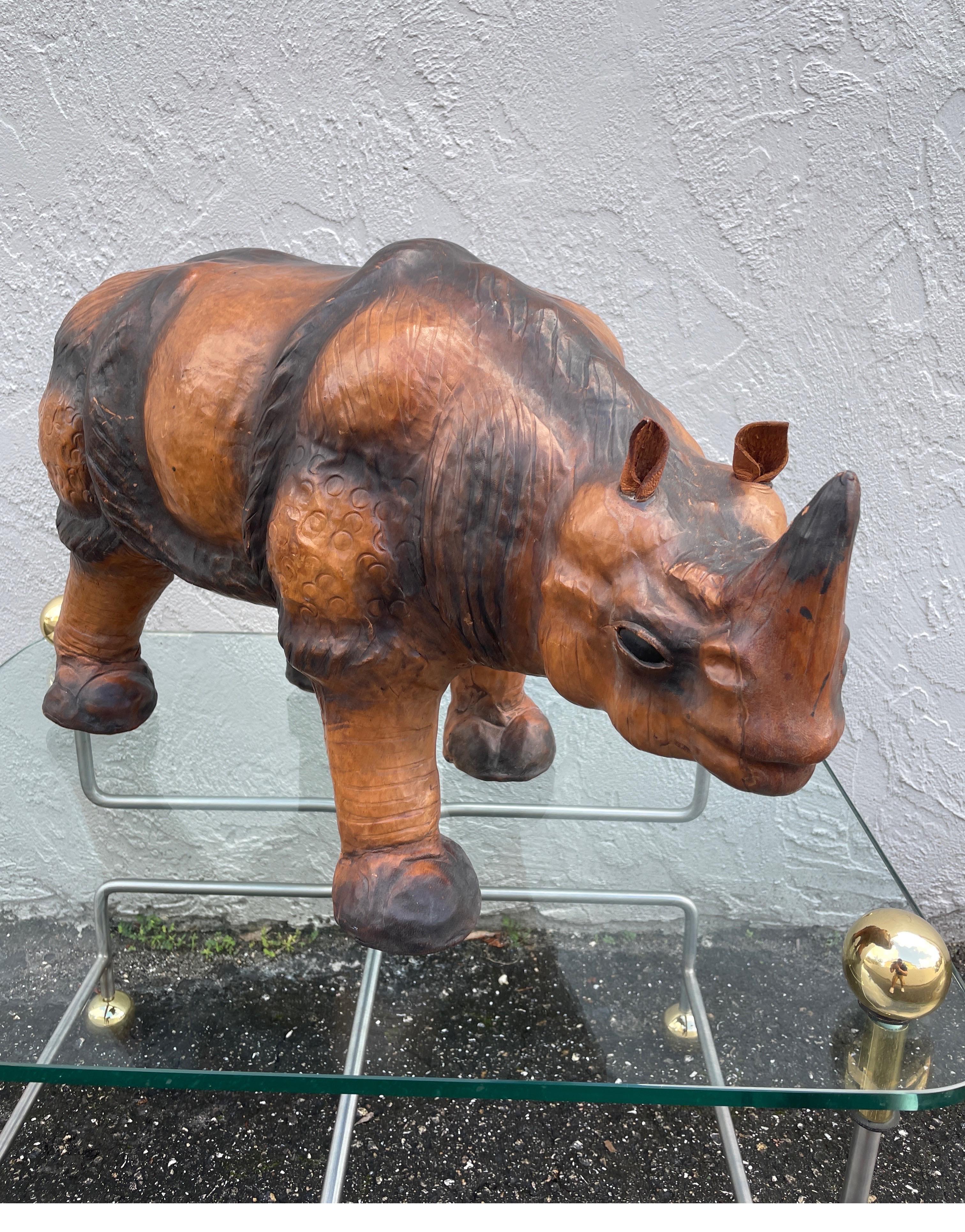 Leather Rhinoceros footrest that will add a whimsical touch to any room. Very well made & quite sturdy.