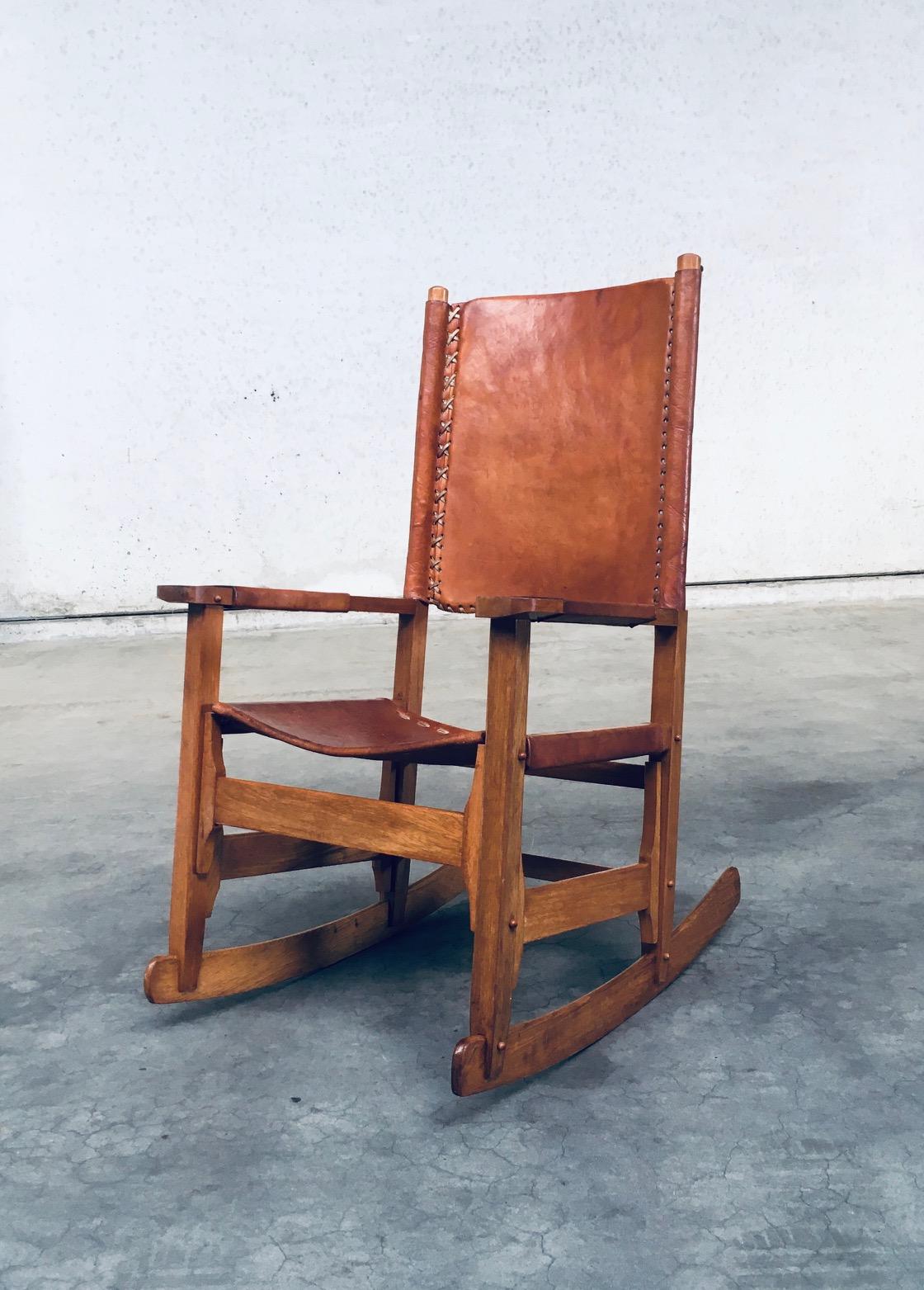 Vintage South American Design Leather Rocking Chair by Werner Biermann for Artesano Arte Sano Bogota. Made in Colombia, 1960's period. Has a manufacturing stamp on the inside beneat the seat. Thick leather seat and back with leather cross