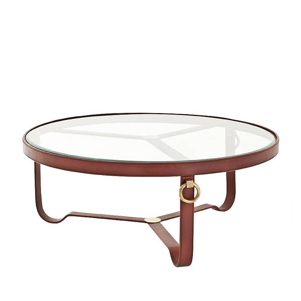 Coffee table leather round with structure in stainless
steel covered with brown genuine leather. With antique
brass finish and with clear glass top.
Also available in leather round side table.