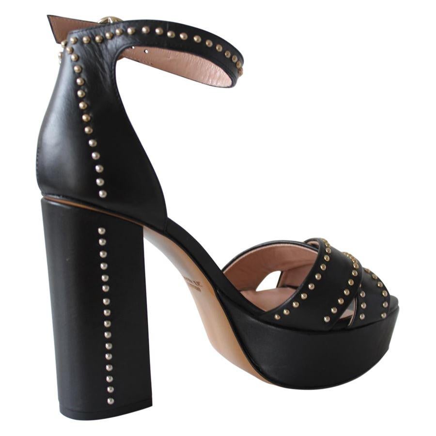 Boutique Moschino Leatheer Black color Metal studs Ankle buckle Heel height cm 11 (4.33 inches) Plateau height cm 3 (1.18 inches)
