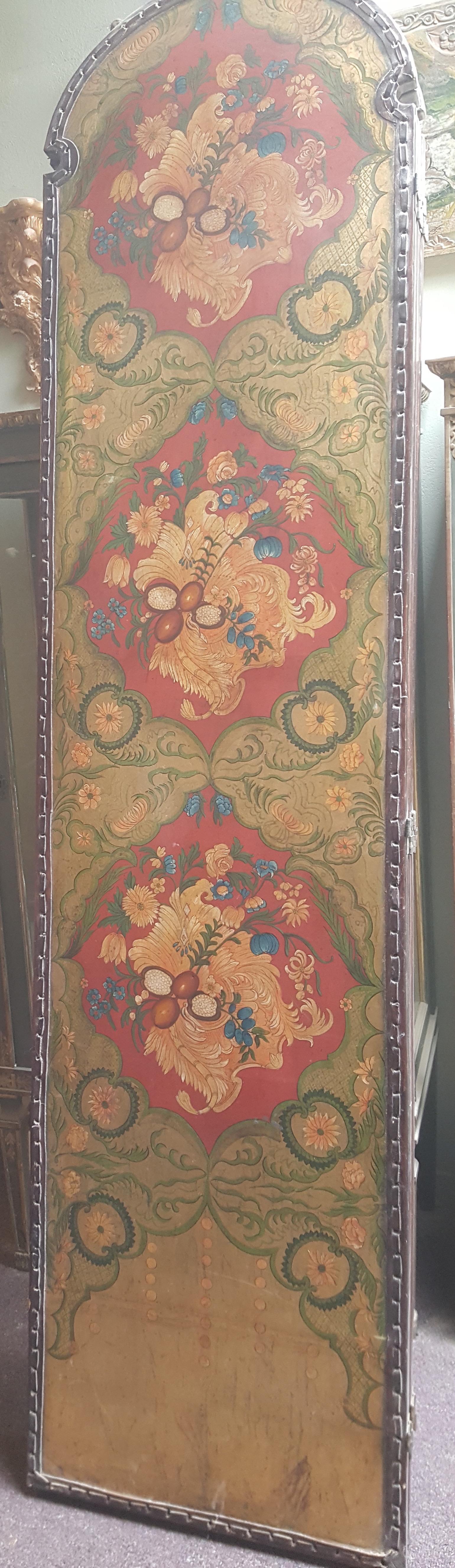 4 panel screen with gilded floral scene on leather. Back panel is also leather wrapped with woven leather detail at edge.