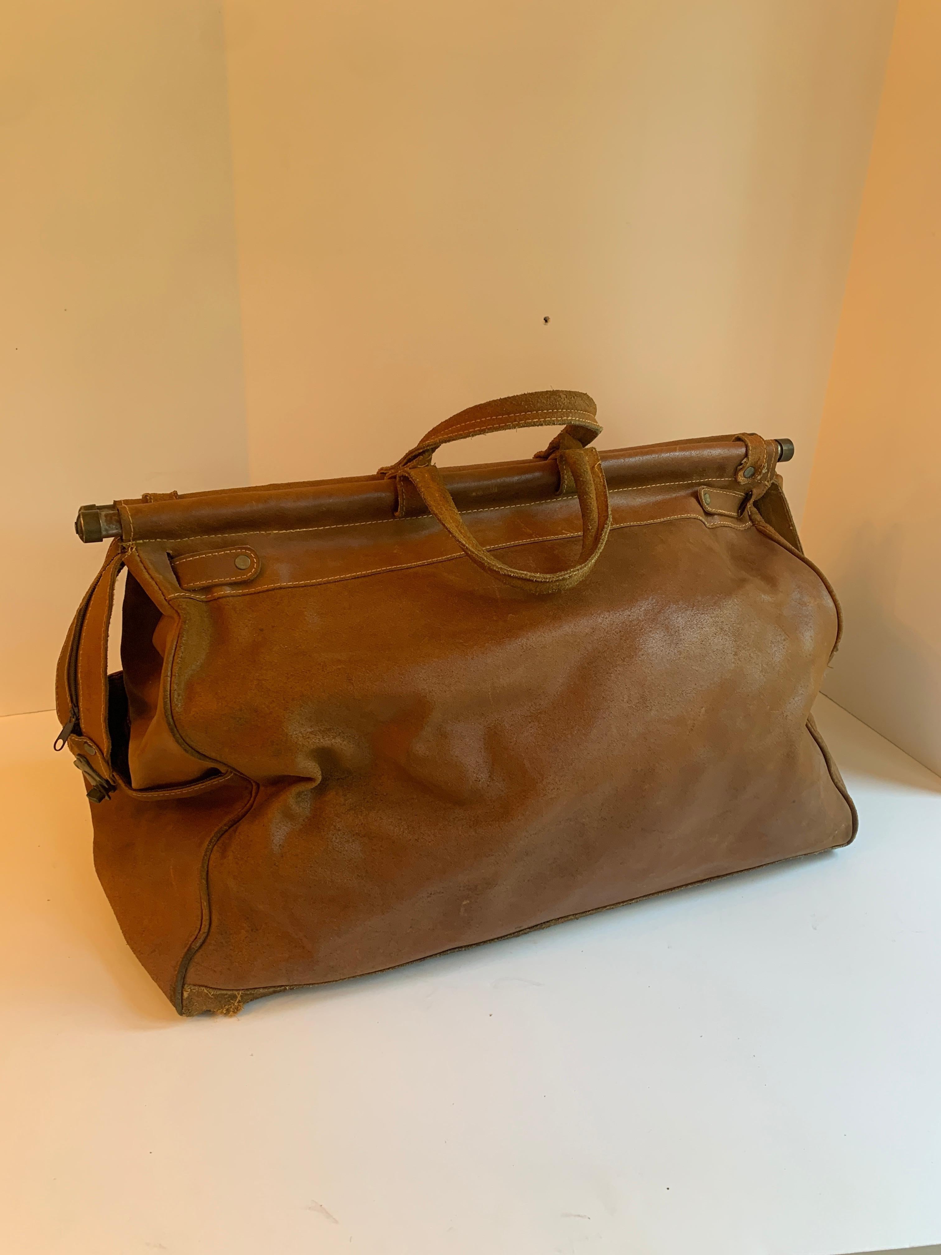20th Century Leather Shoulder Duffle Style Bag with Brass Supports For Sale
