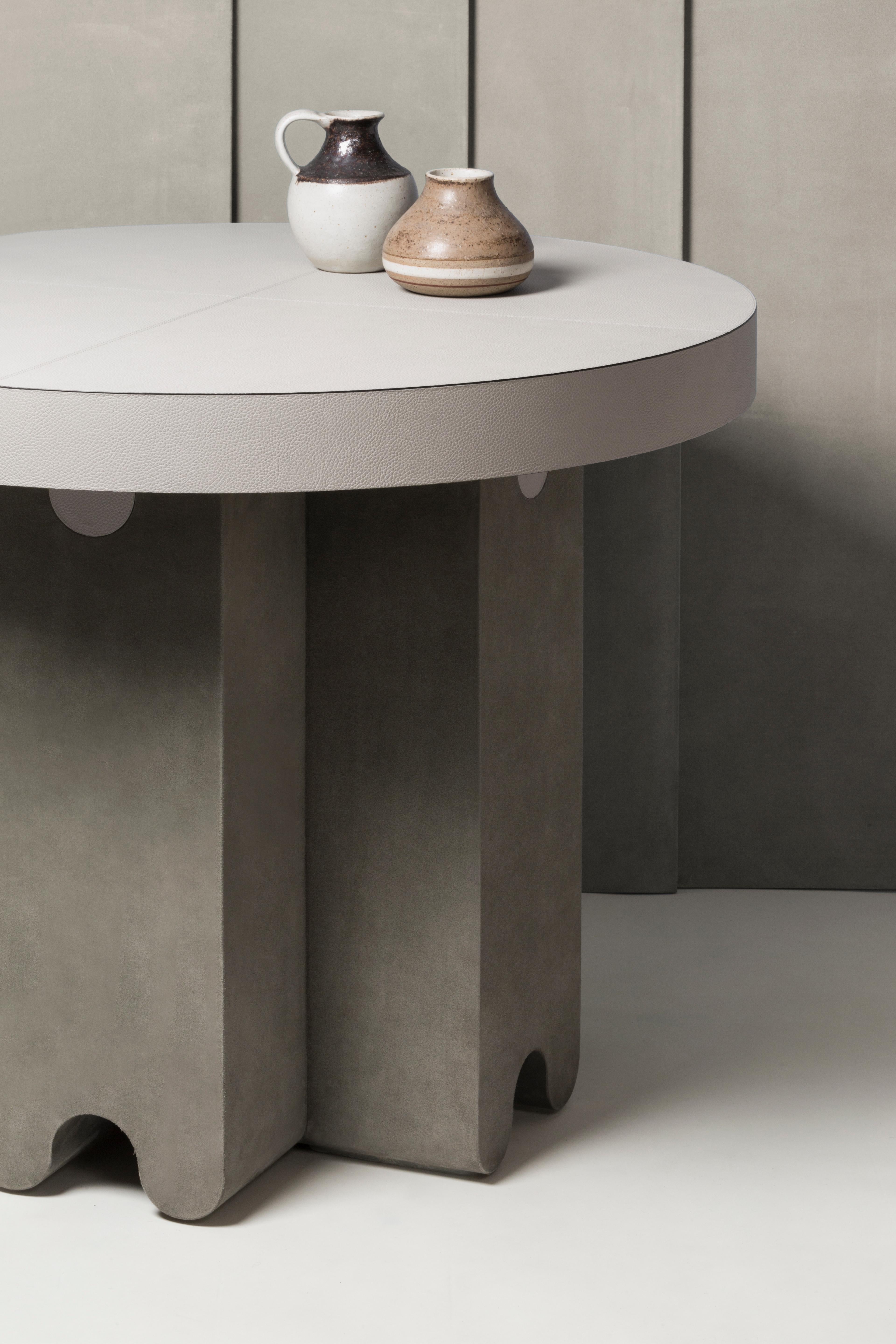 Ossicle Leather Round Table -- Francesco Balzano x Giobagnara

Top available only in printed calfskin, suede, nappa finish; legs available only in suede. Pictured here is the table with H37 Light Grey printed calfskin deer top and A69 Sage suede