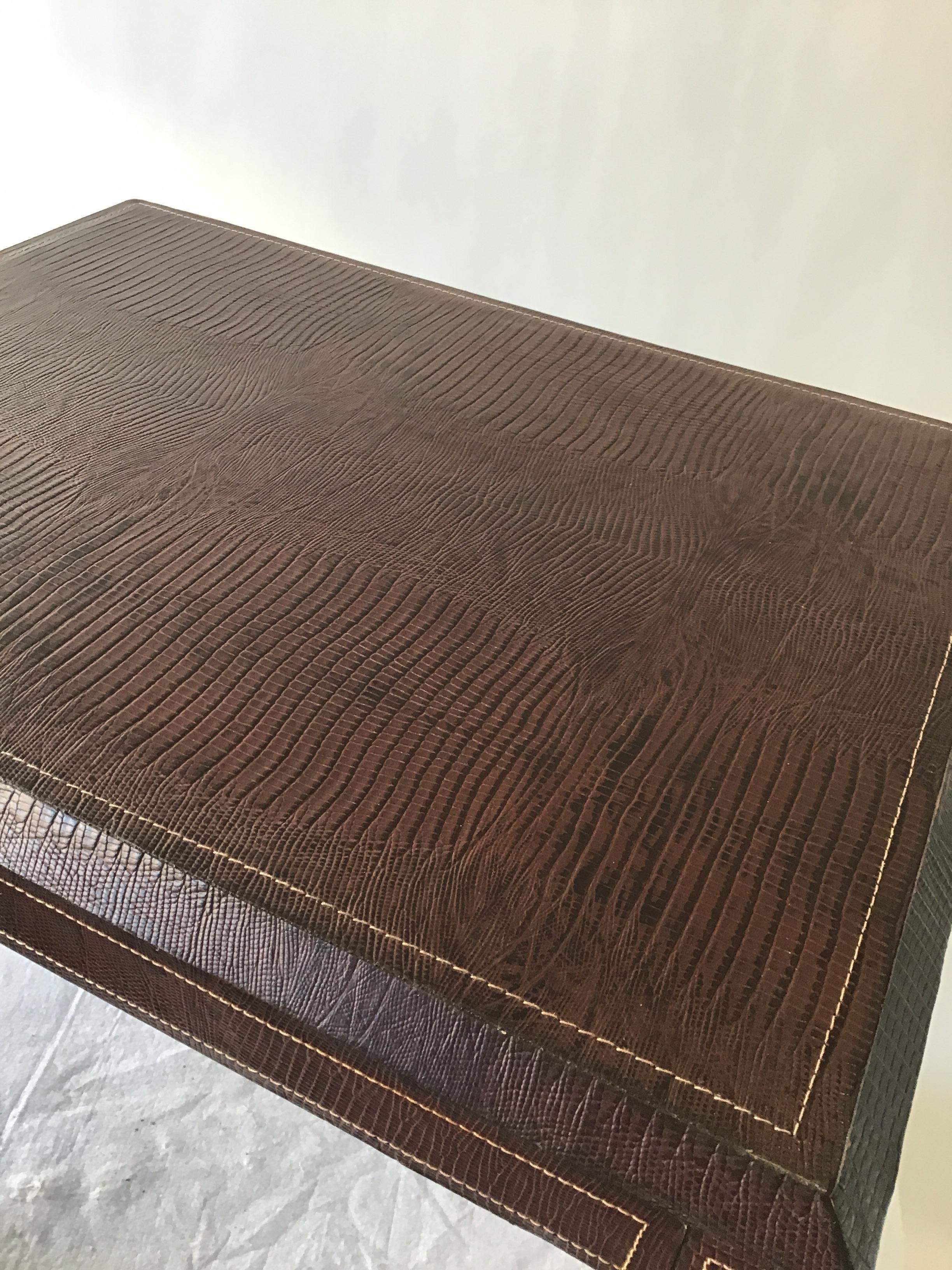 Lizard embossed leather side table with top stitching.