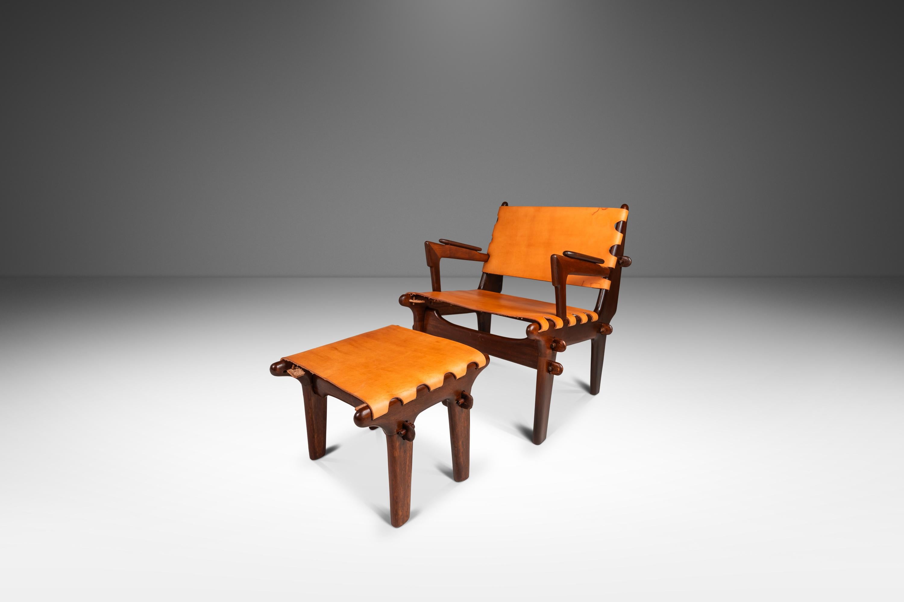 Introducing a rare sling chair and ottoman set by the incomparable Angel Pazmino. Recently and painstakingly restored by our team of craftsmen this iconic set has a new lease on life and we love the results. The solid jacaranda wood frames have been