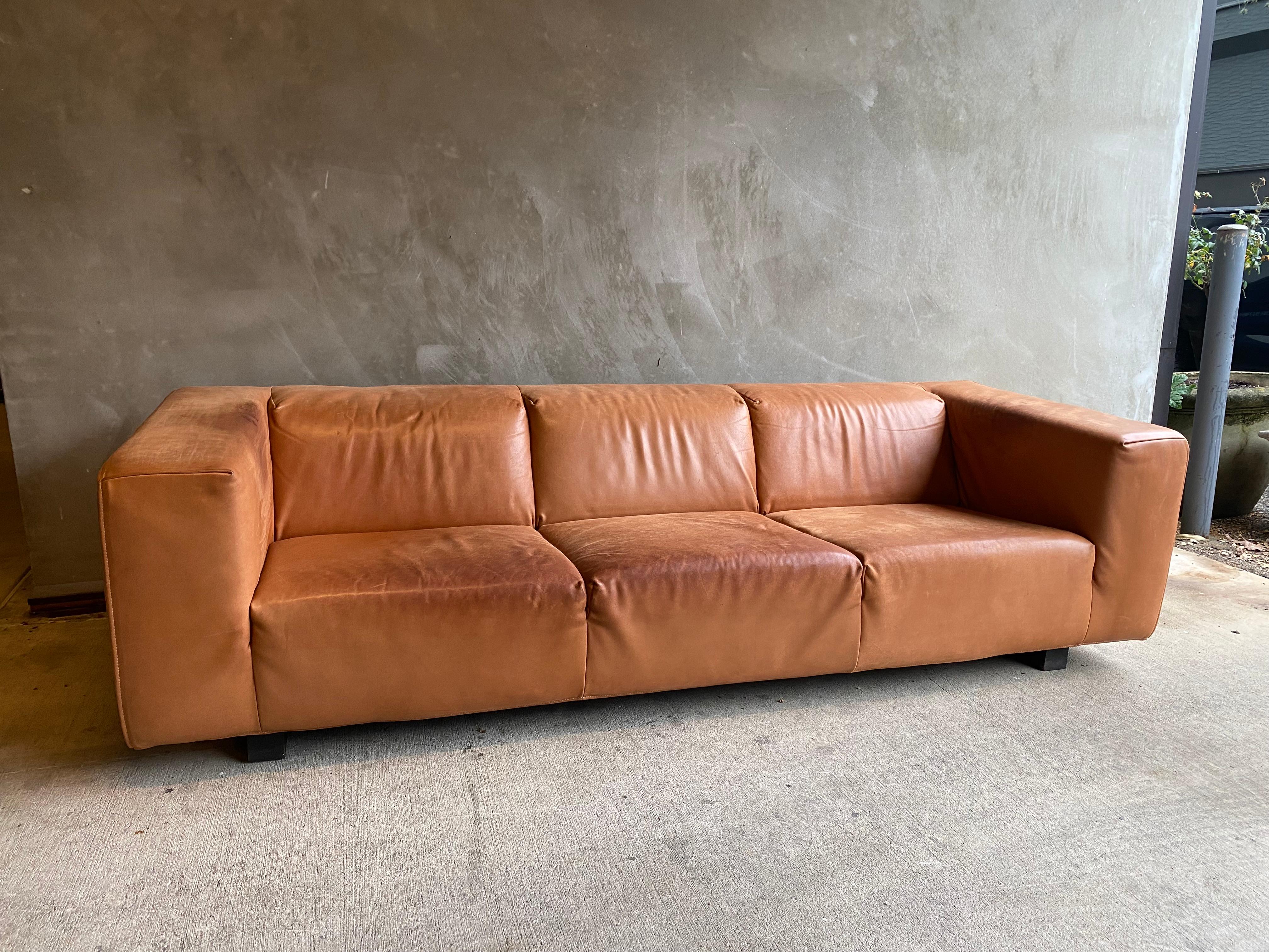 Exceptionally clean-lined vintage leather sofa of great scale and proportion in cognac leather by Dutch maker, Gerard Van Den Berg. Leather is in great condition with the perfect amount of patina. Comfortable. Netherlands, 1980's.