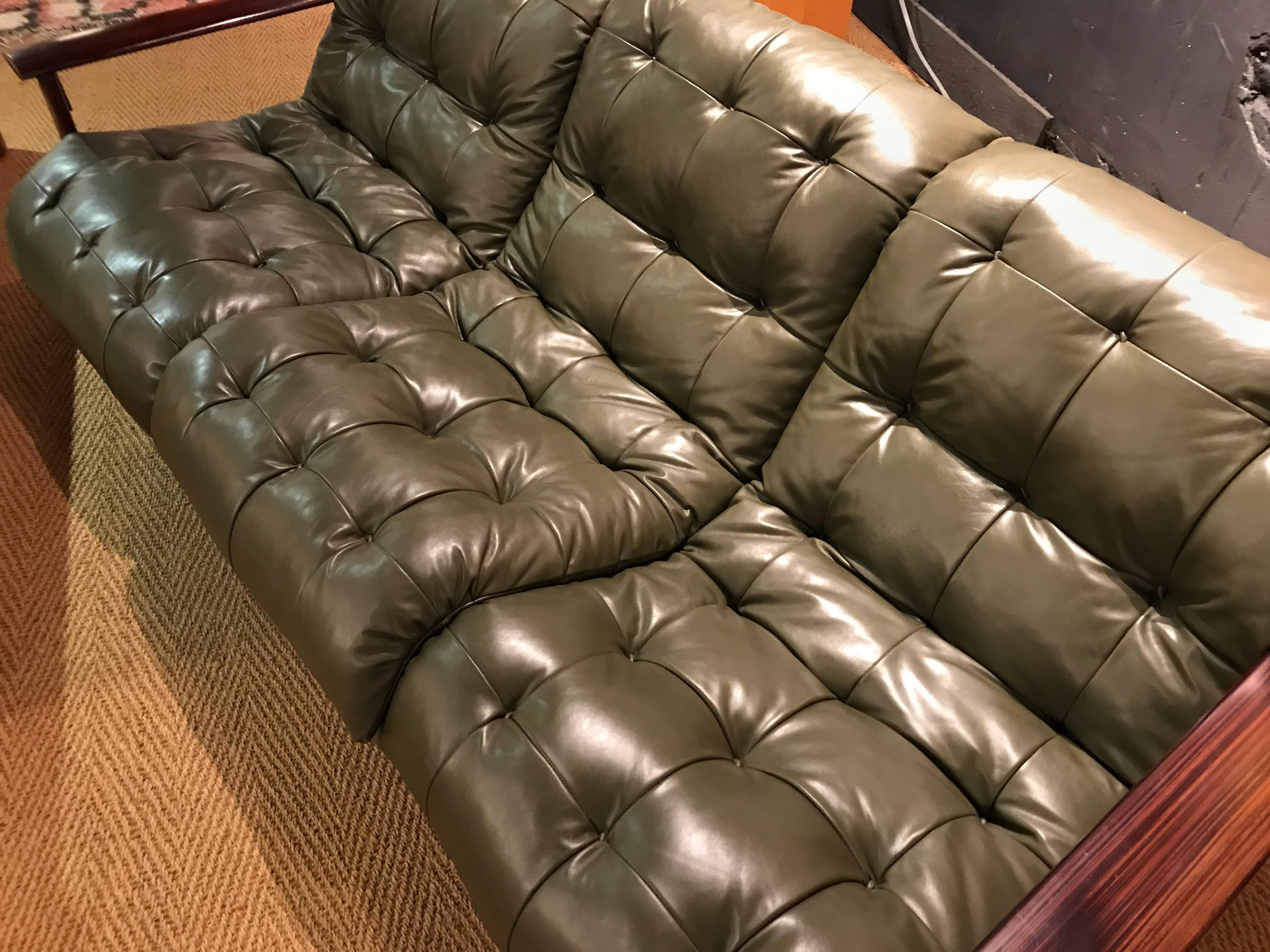 Lounge sofa by Percival Lafer in tufted olive leather upholstery. Very good vintage condition, upholstery and leather strapping in excellent condition for age and use.