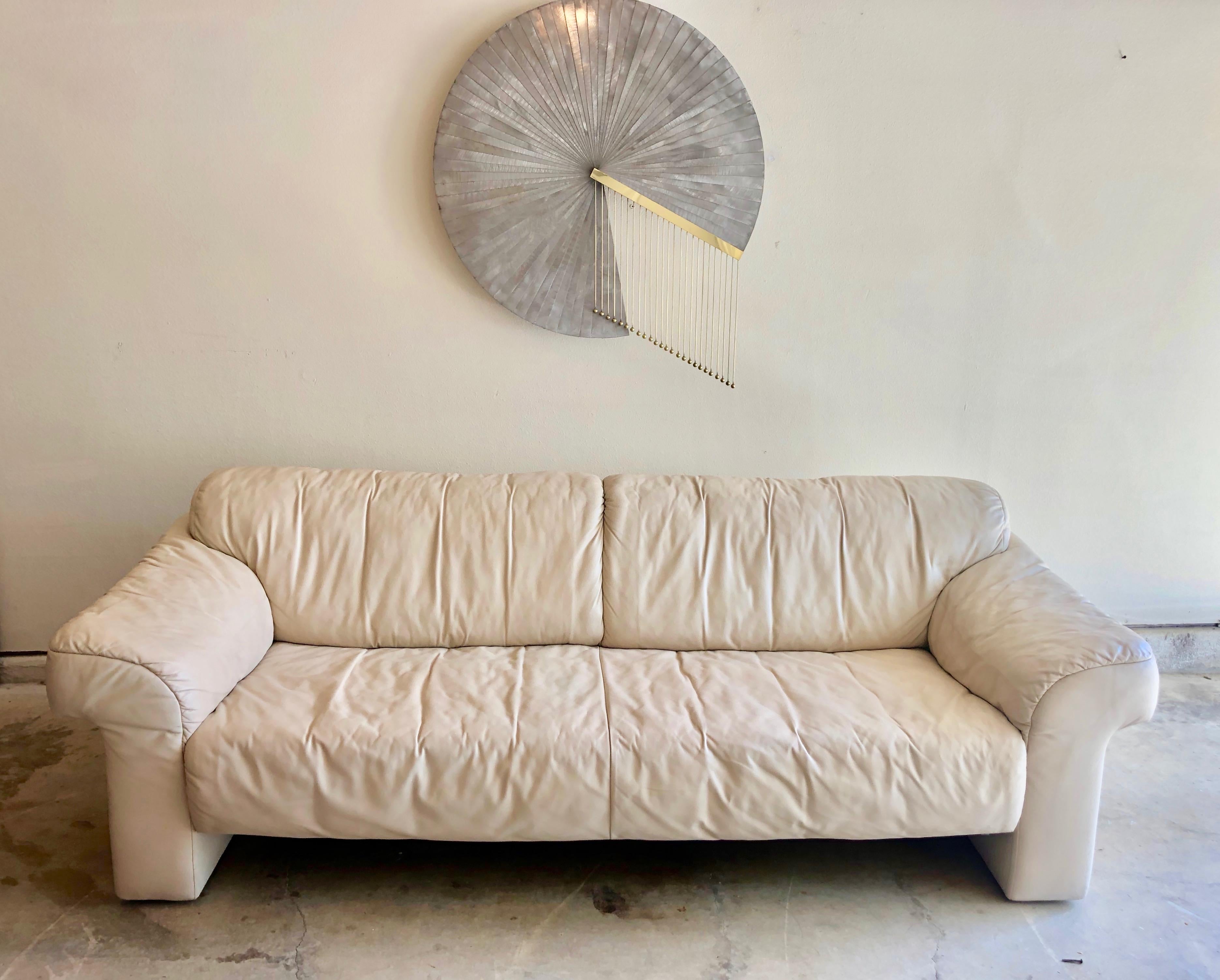 Leather sofa by WK Möbel in a light cream / ivory color. This sofa is extremely comfy and great for long term lounging!