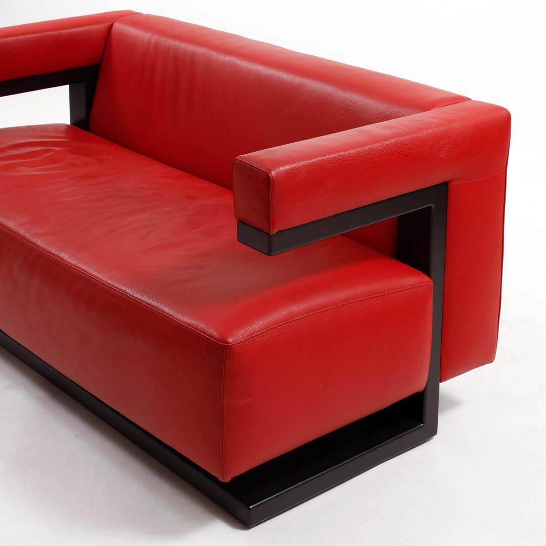 Hardwood frame black painted and upholstered with red leather. Designed by the founder of the Bauhaus Walter Gropius in 1920. The F51-2 2-seat sofa as a complementary piece of furniture to his strictly geometric and cubic director's room at the